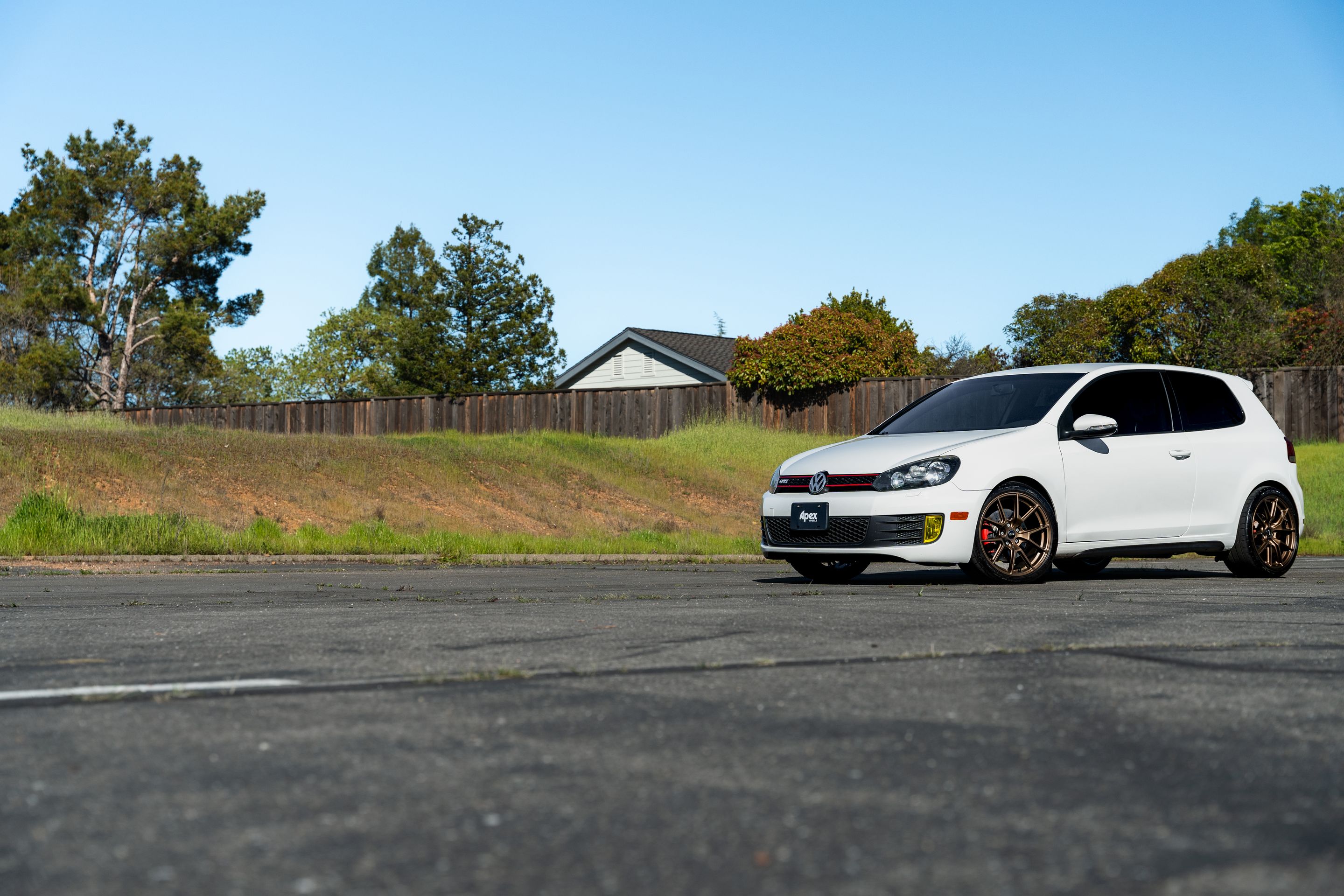 White VW MK6 GTI with 18" VS-5 Apex wheels in Satin Bronze