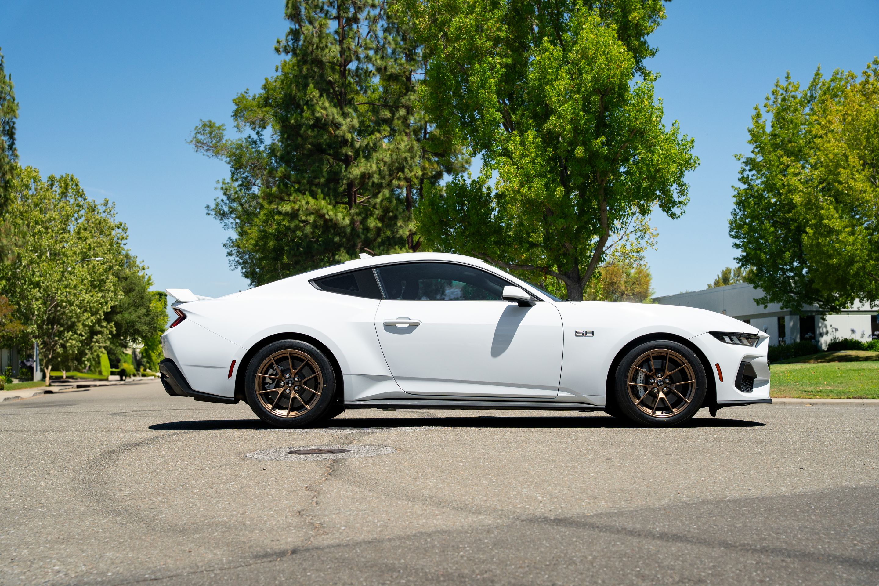 White Ford S650 Mustang GT with 18" VS-5RS Apex wheels in Satin Bronze