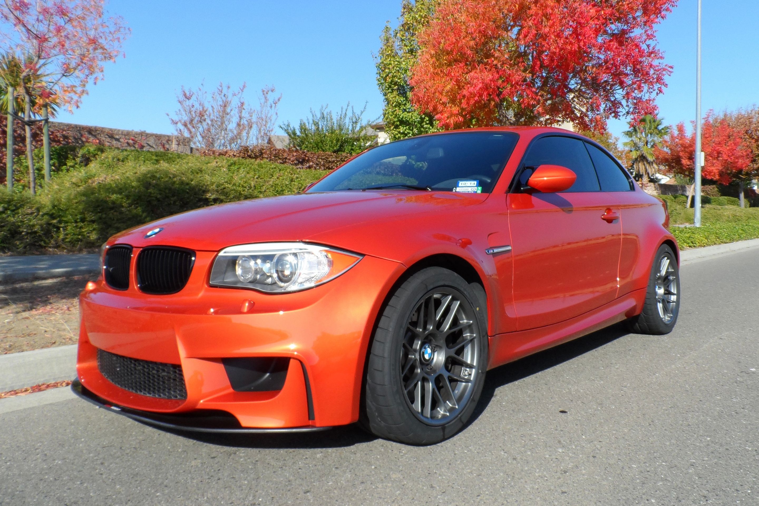 Orange BMW E82 1M with 18" ARC-8 Apex wheels in Satin Black