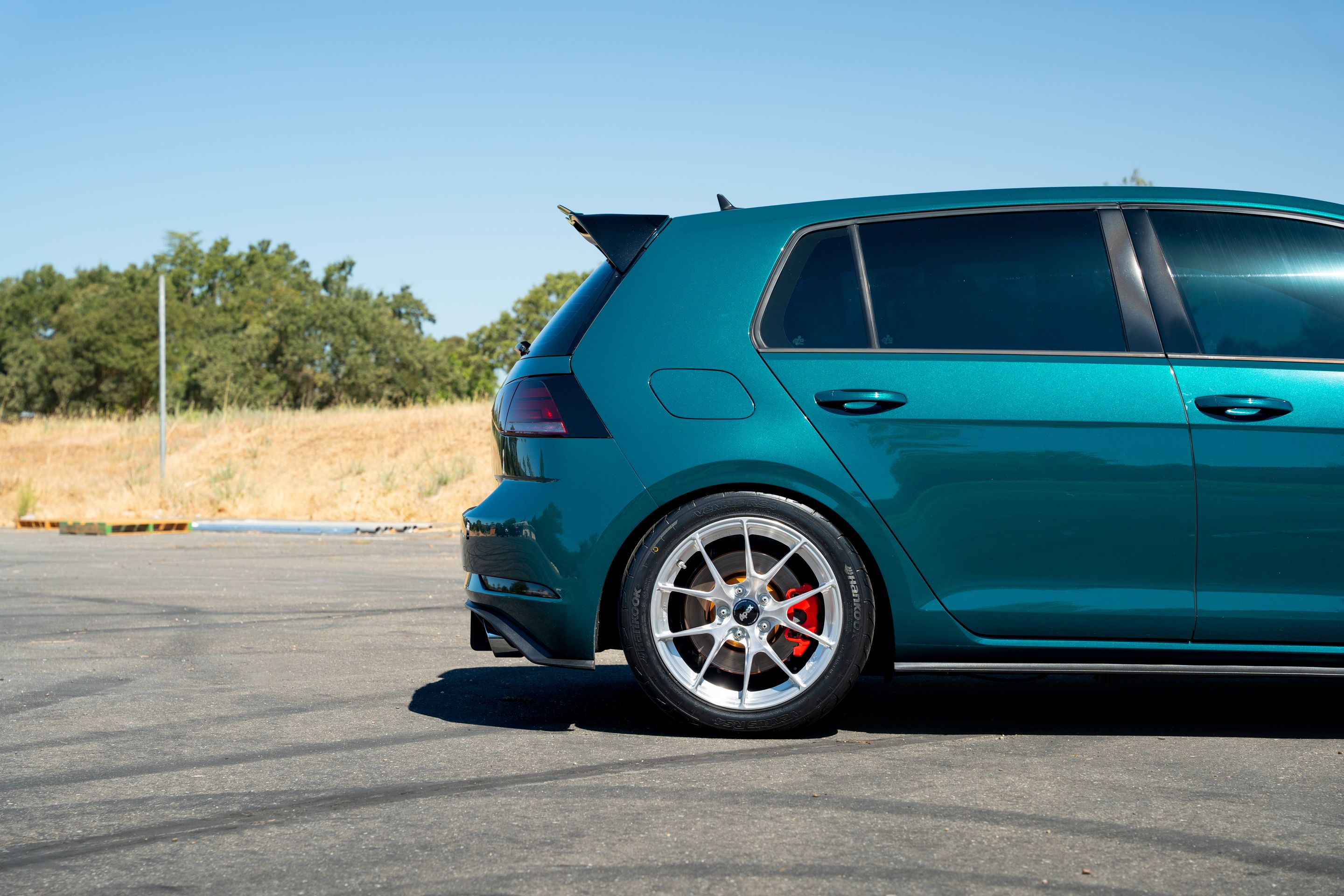 Green VW MK7 GTI with 17" VS-5RS Apex wheels in Brushed Clear