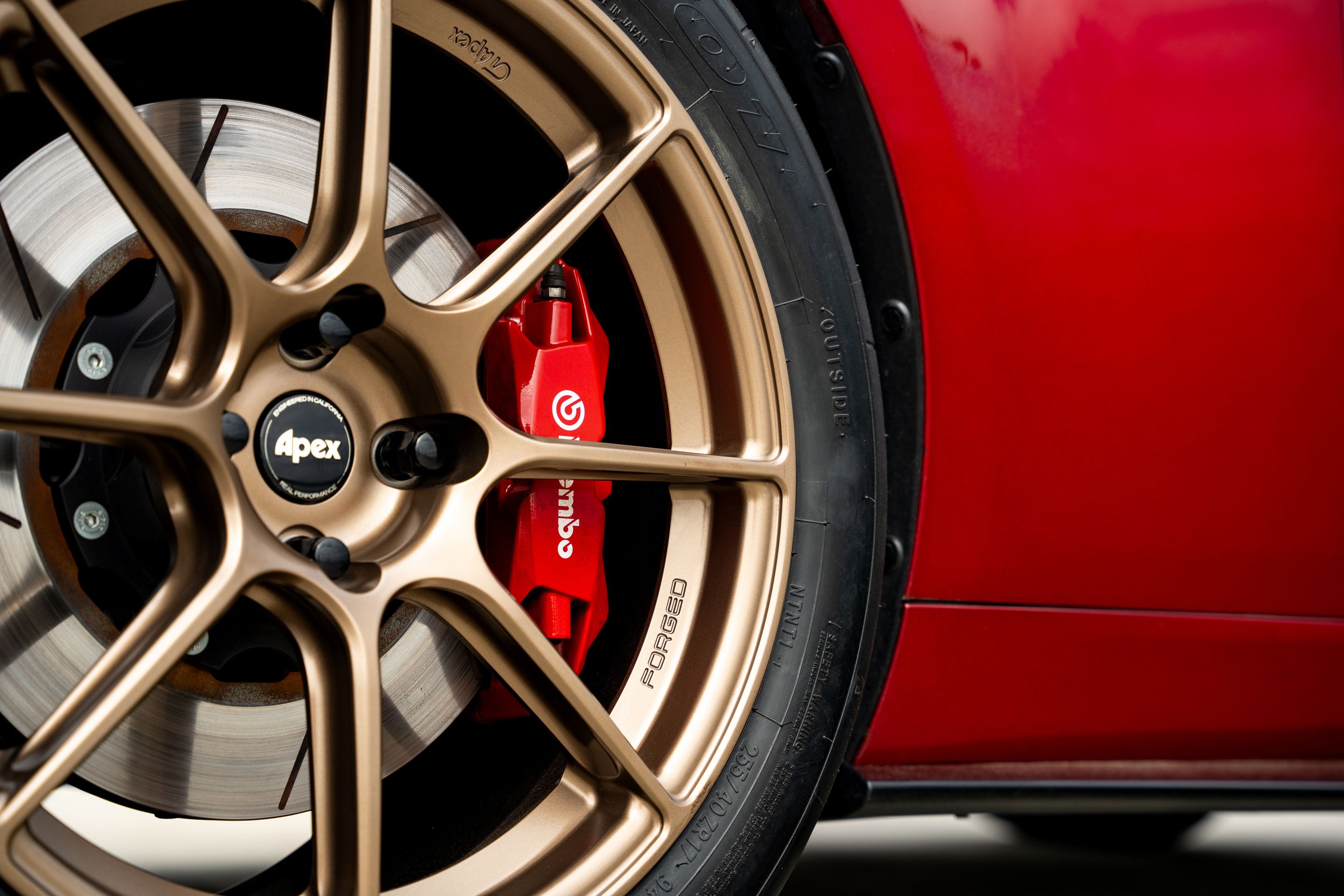 Red Mazda ND MX-5 Miata with 17" SM-8RS Apex wheels in Satin Bronze