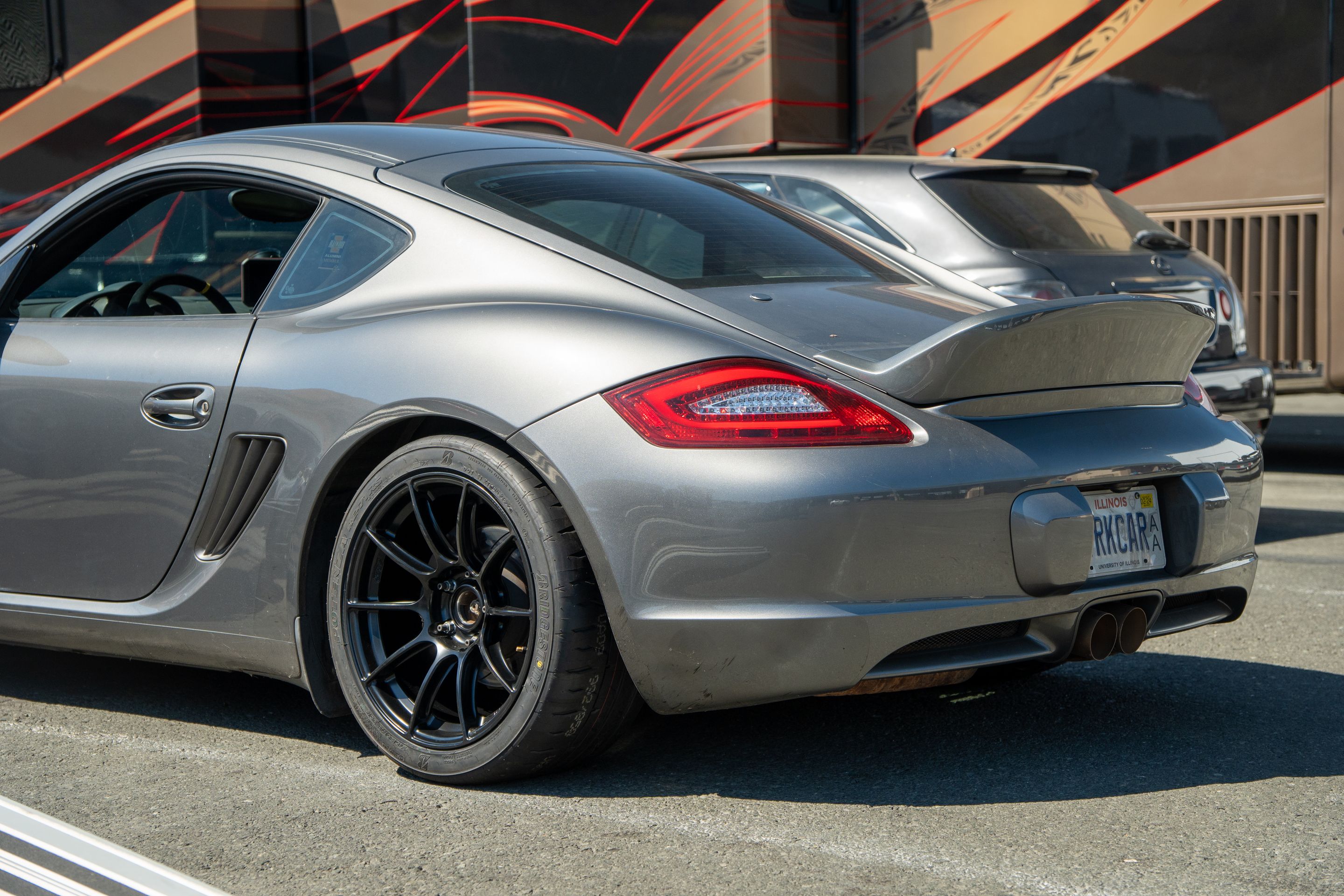 Grey Porsche 987 Cayman S with 18" SM-10RS Apex wheels in Satin Black