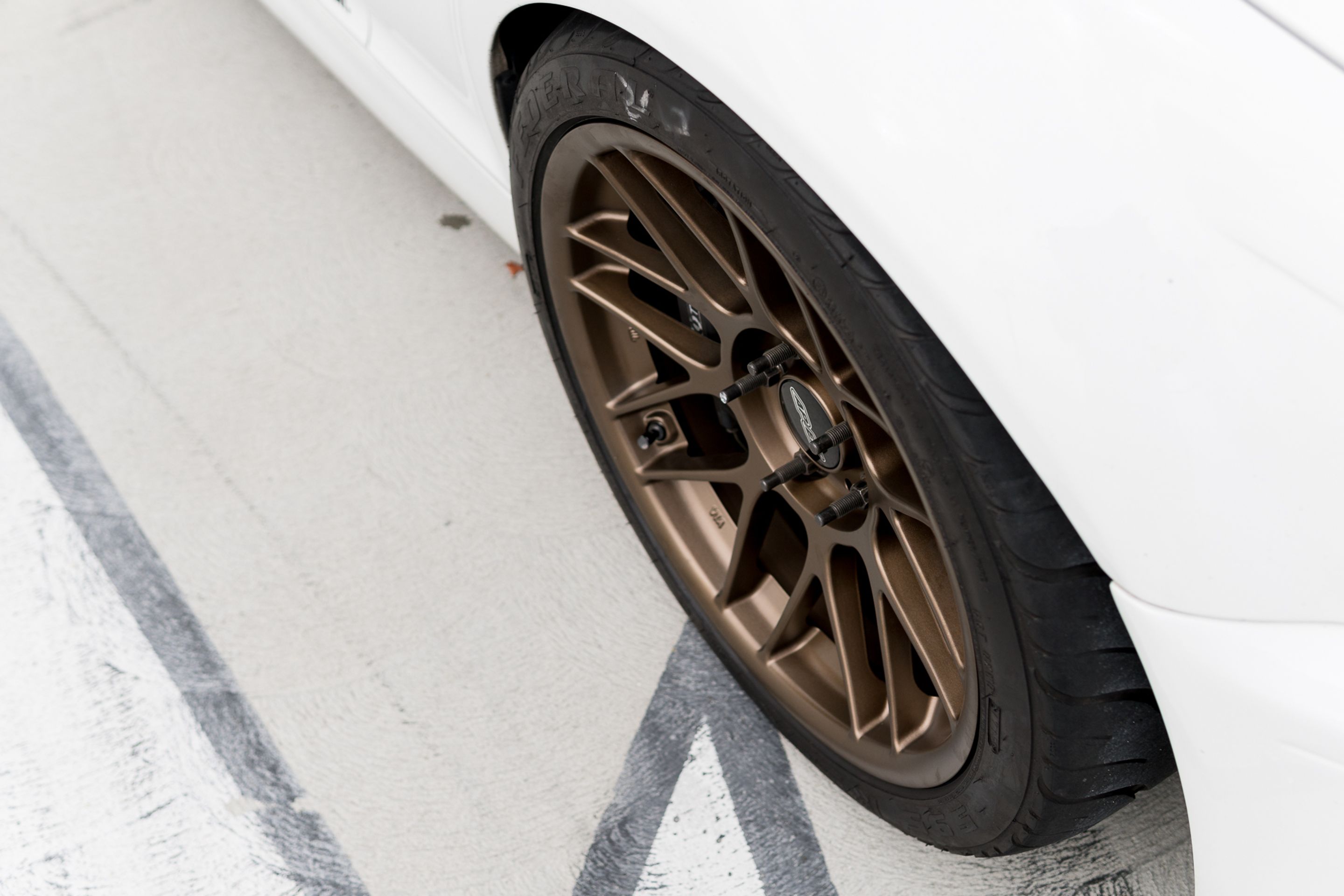 White BMW E46 M3 with 18" ARC-8 Apex wheels in Satin Bronze