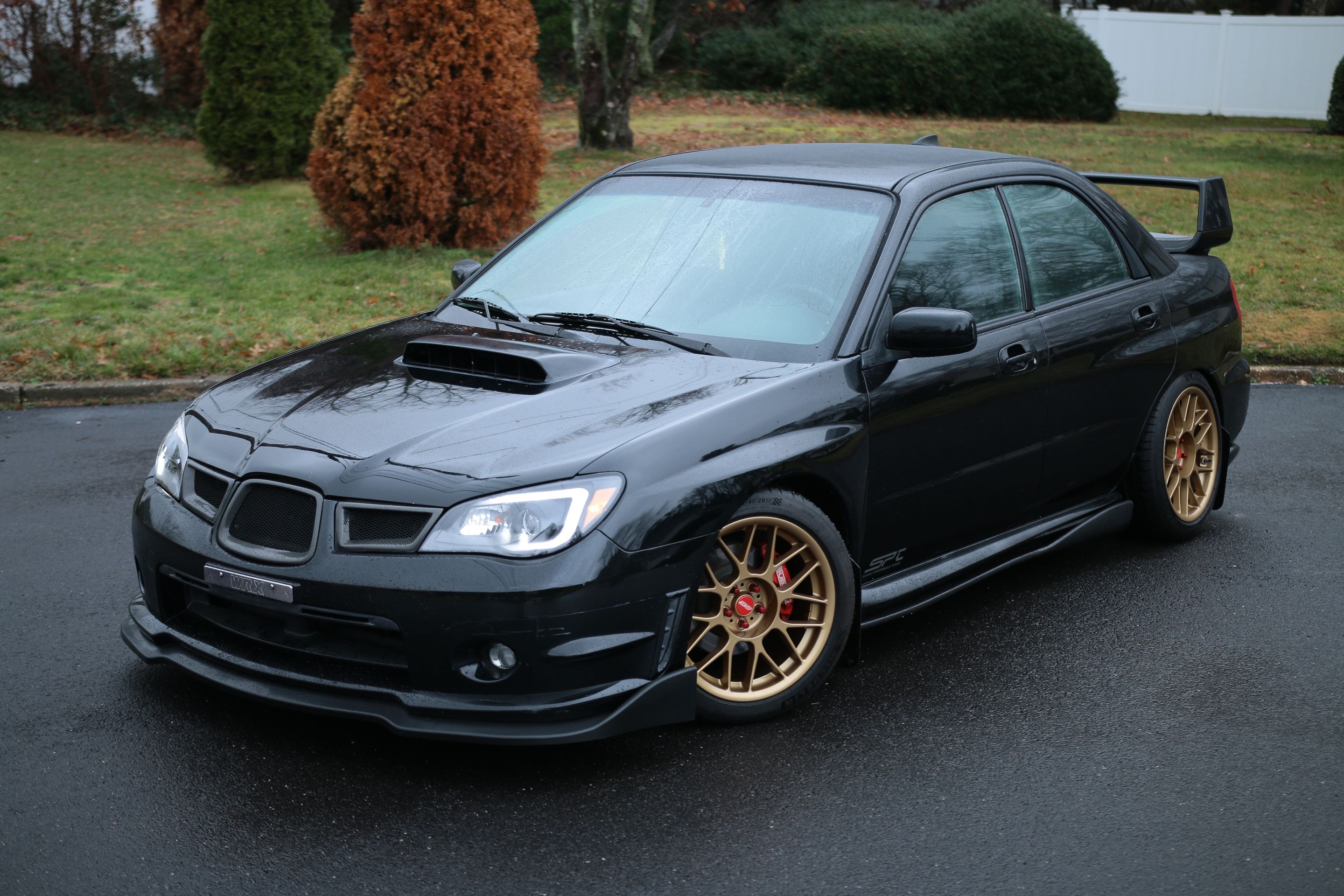 Black Subaru GD WRX Sedan with 17" ARC-8 Apex wheels in Satin Bronze