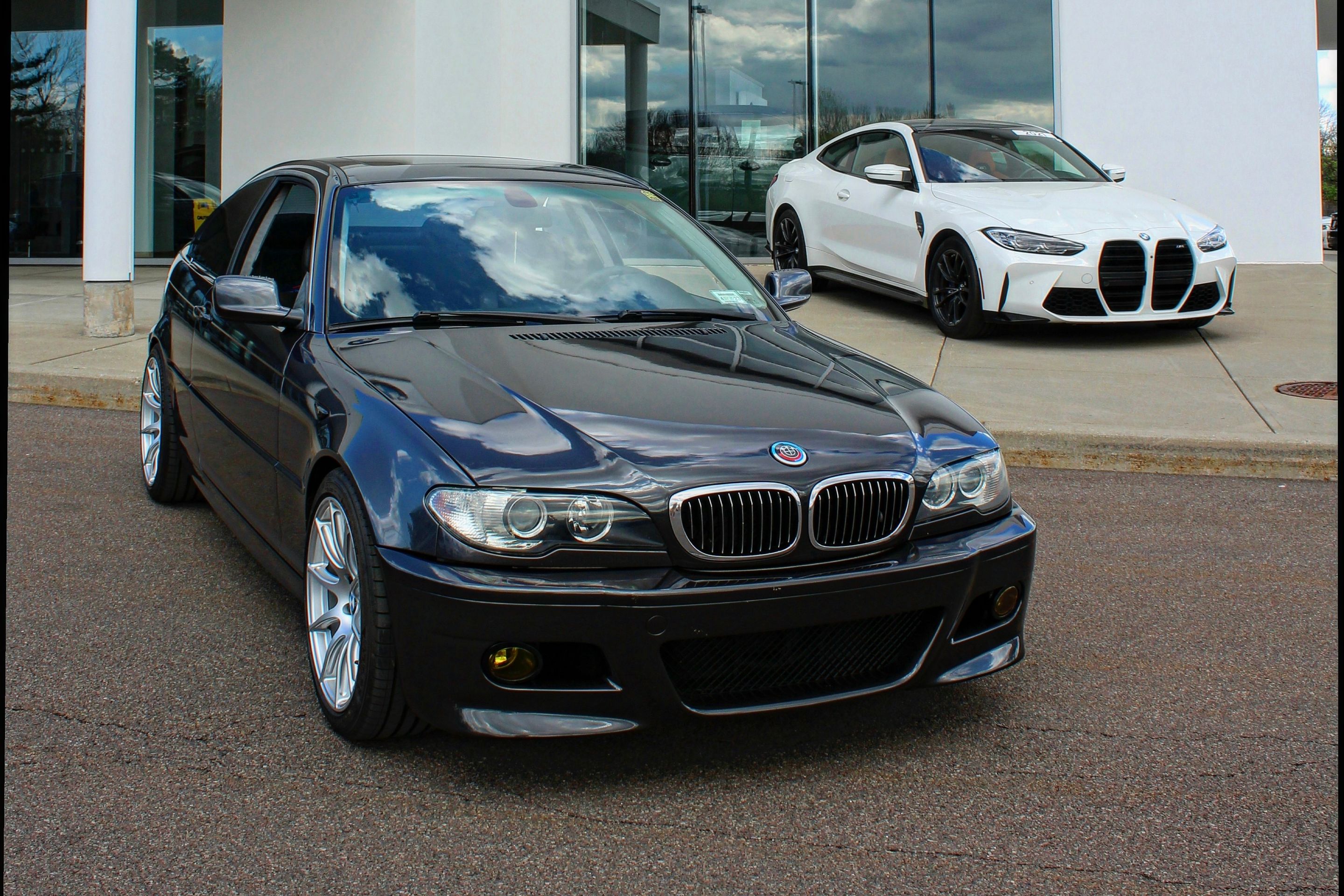 Black BMW E46 3 Series with 18" SM-10 Apex wheels in Race Silver