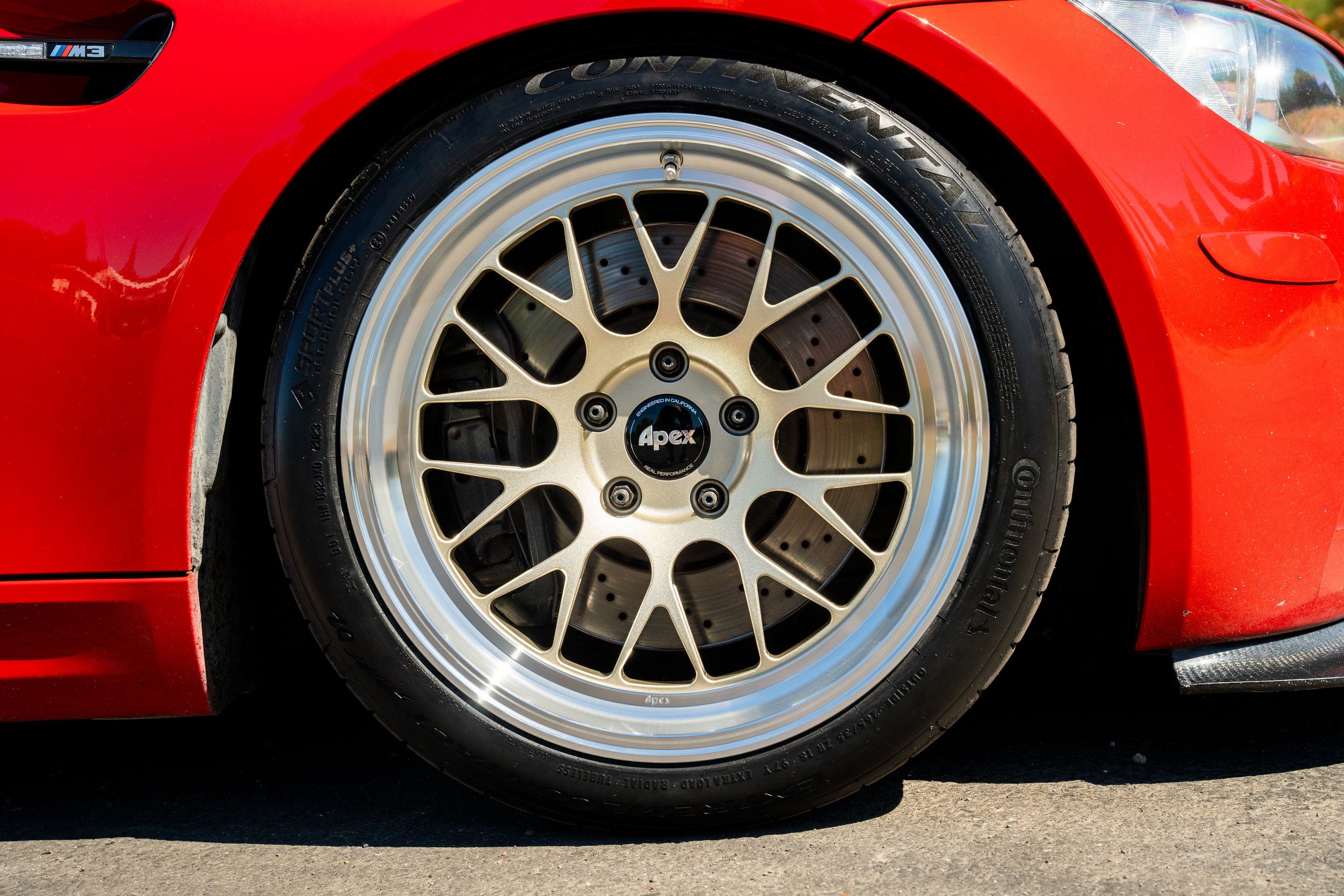 Red BMW E92 Coupe M3 with 18" ML-10RT Apex wheels in Machined Lip Gloss Motorsport Gold