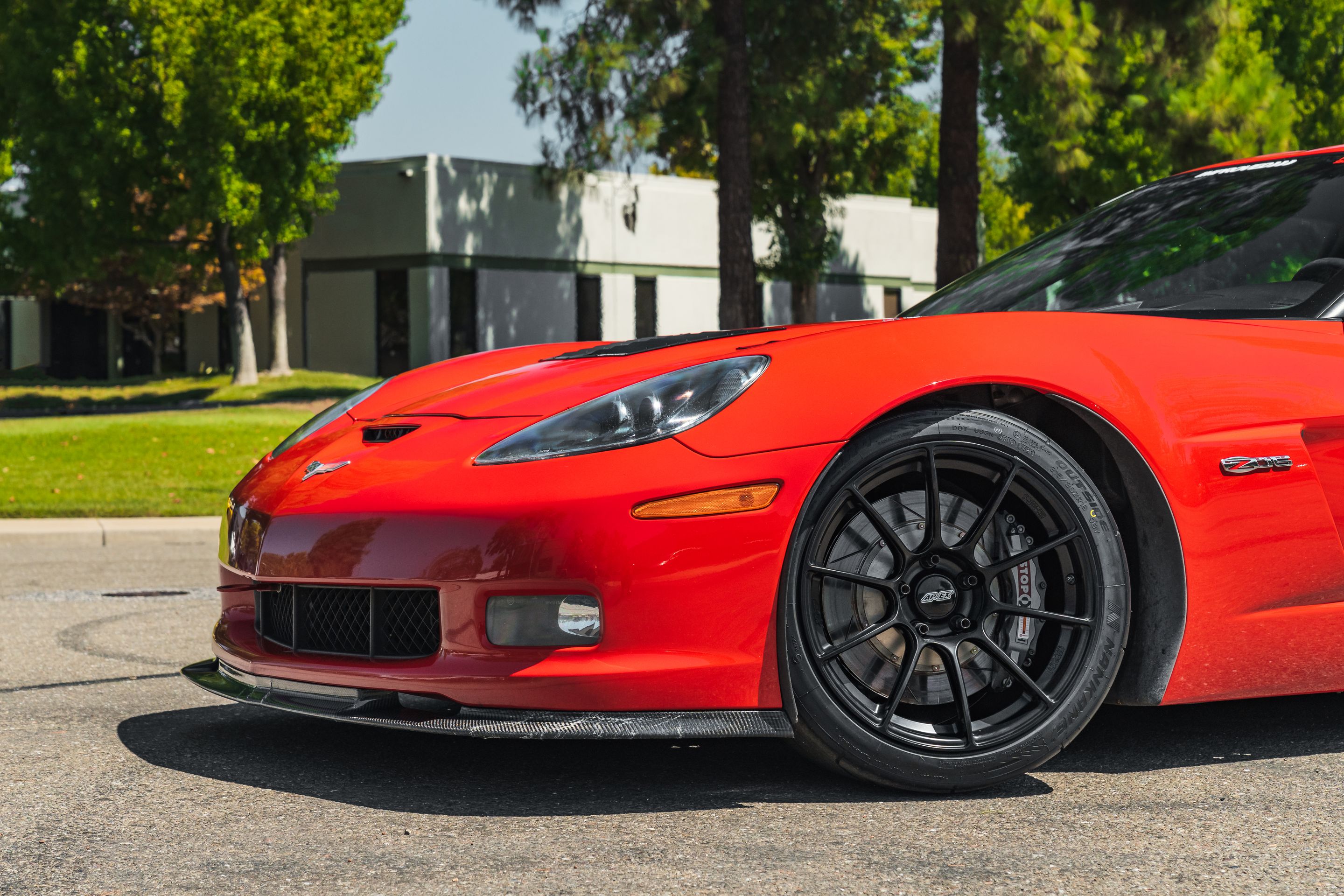 Red Chevrolet C6 Corvette Z06 with 18" SM-10RS Apex wheels in Satin Black