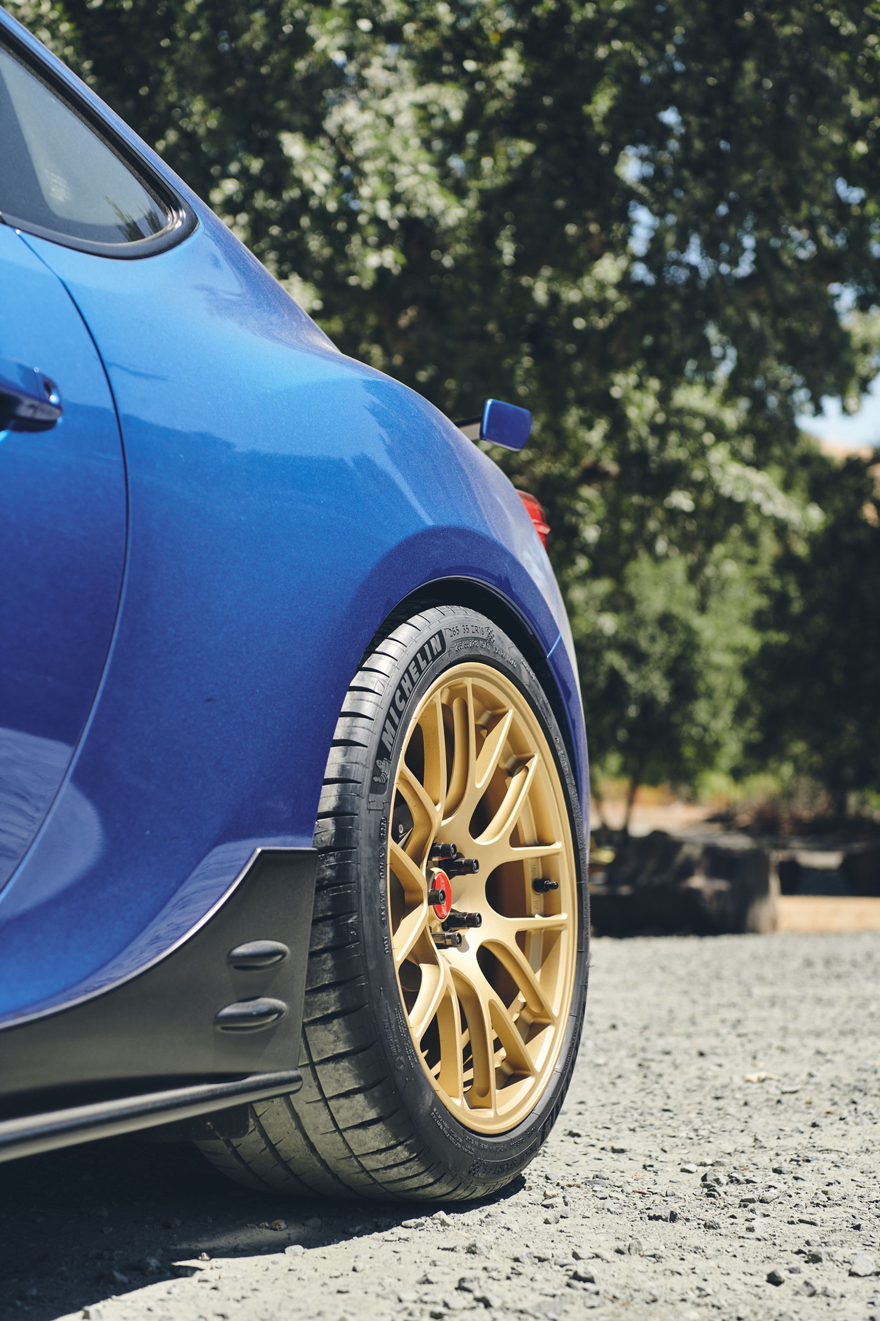 Blue Subaru ZC6 / Gen 1 BRZ with 17" EC-7R Apex wheels in Satin Gold