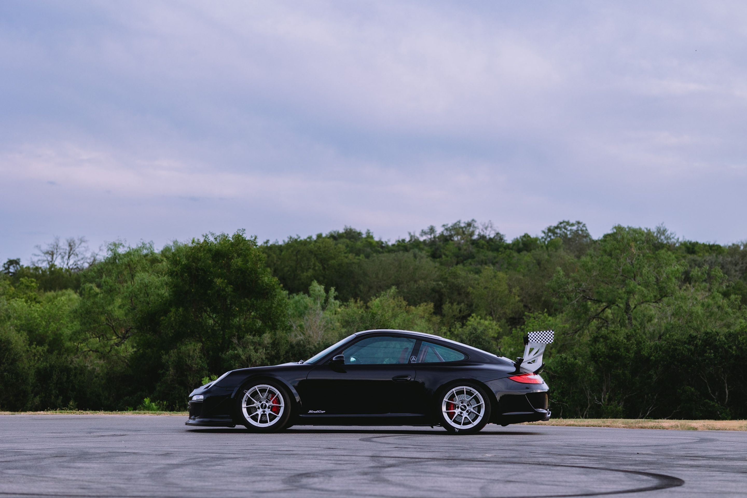 Black Porsche 911 997 Carrera S with 18" VS-5RS Apex wheels in Brushed Clear