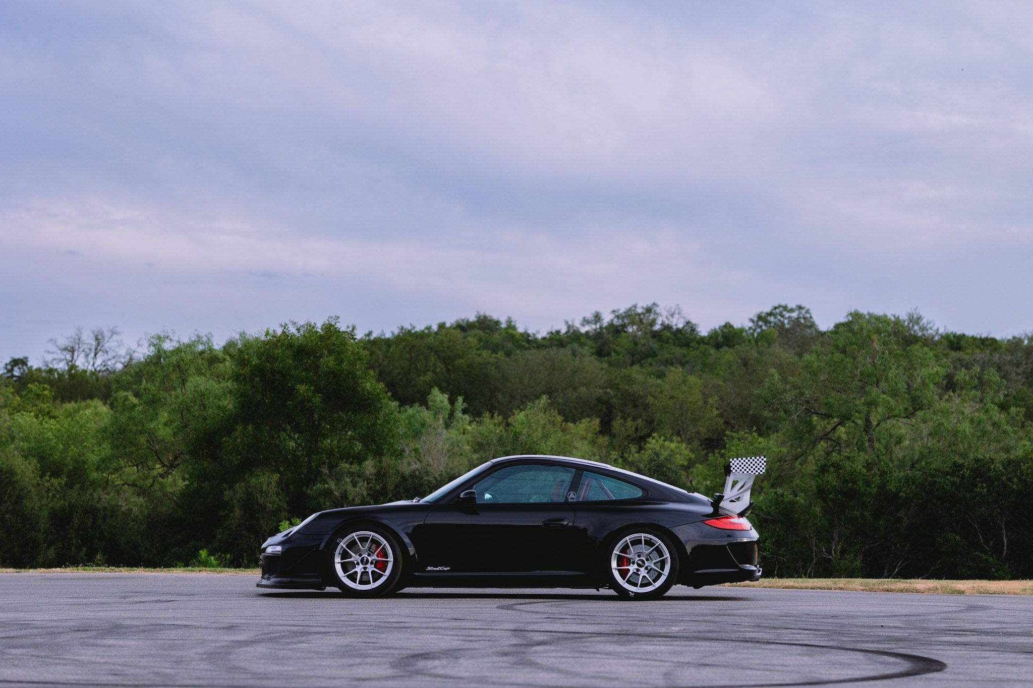 Black Porsche 911 997 Carrera S with 18" VS-5RS Apex wheels in Brushed Clear