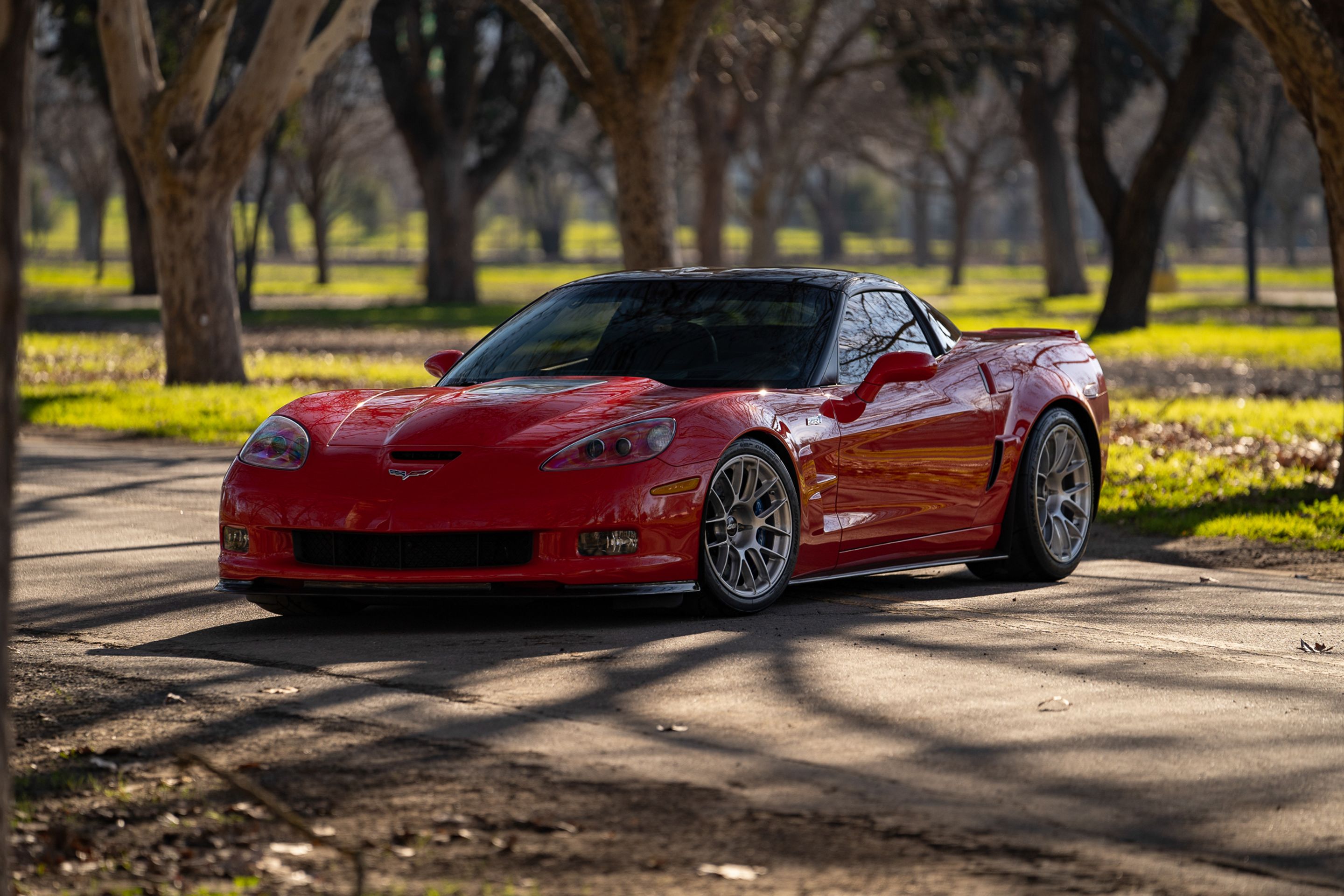 Red Chevrolet C6 Corvette ZR-1 with 18"/19" EC-7RS Apex wheels in Brushed Clear