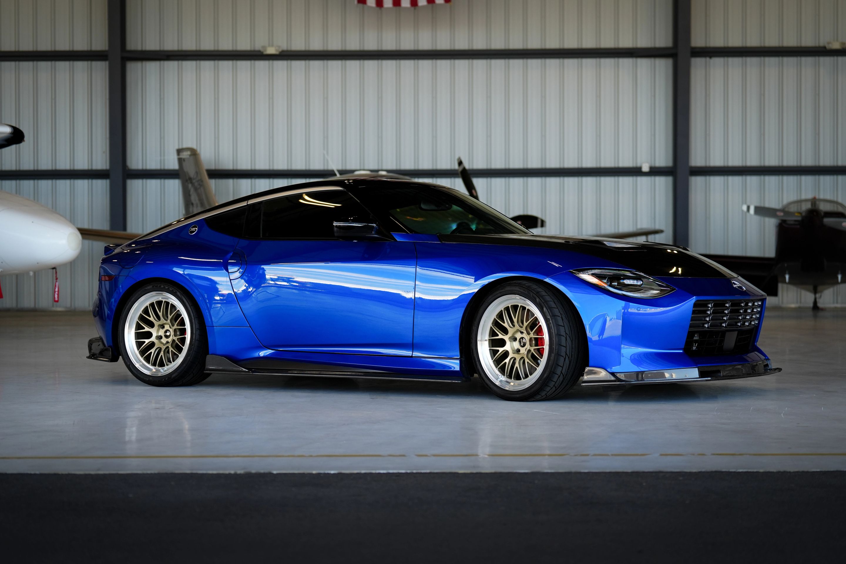 Blue Nissan Z with 19" ML-10RT Apex wheels in Machined Lip Gloss Motorsport Gold