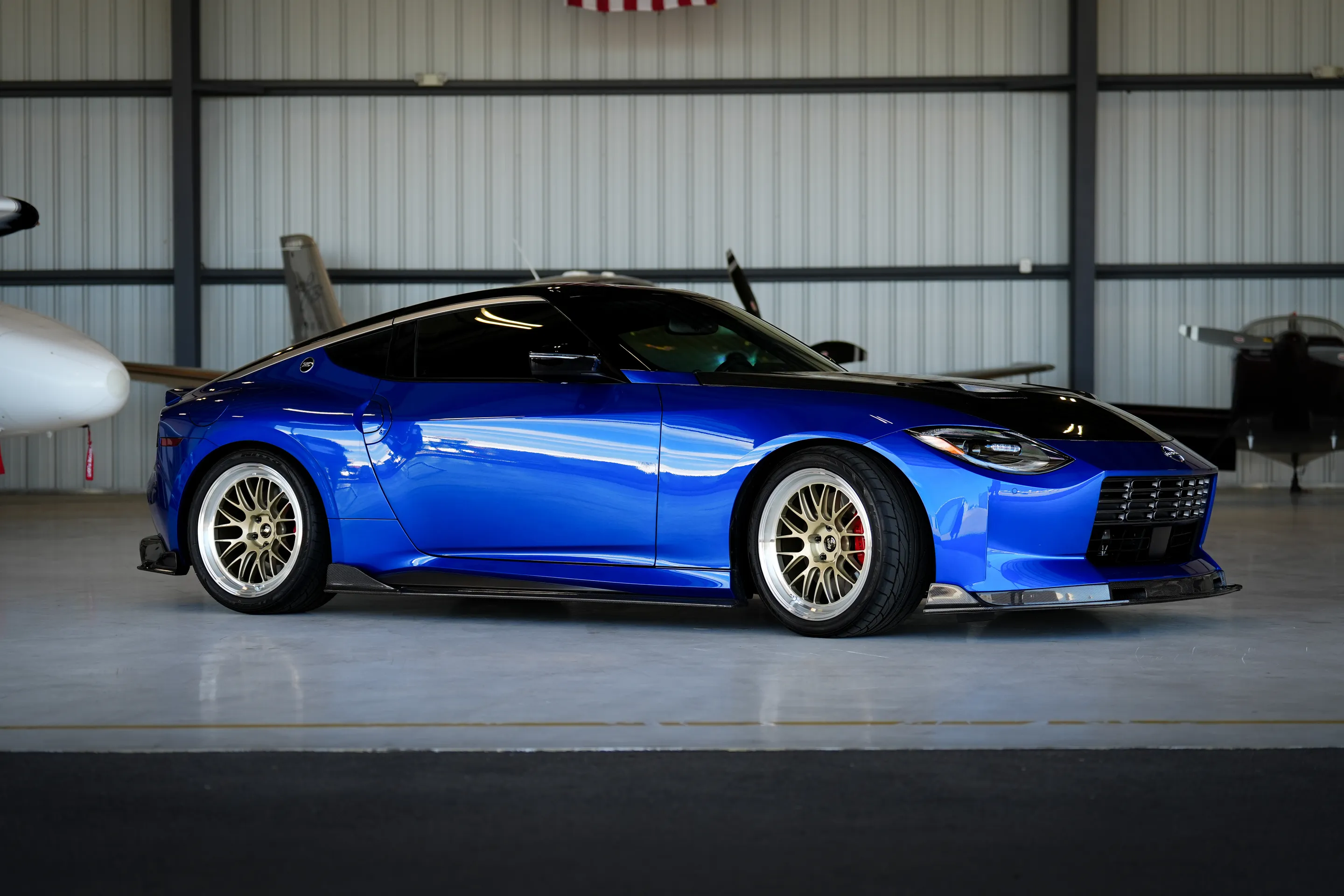 Blue Nissan Z with 19" ML-10RT Apex wheels in Machined Lip Gloss Motorsport Gold