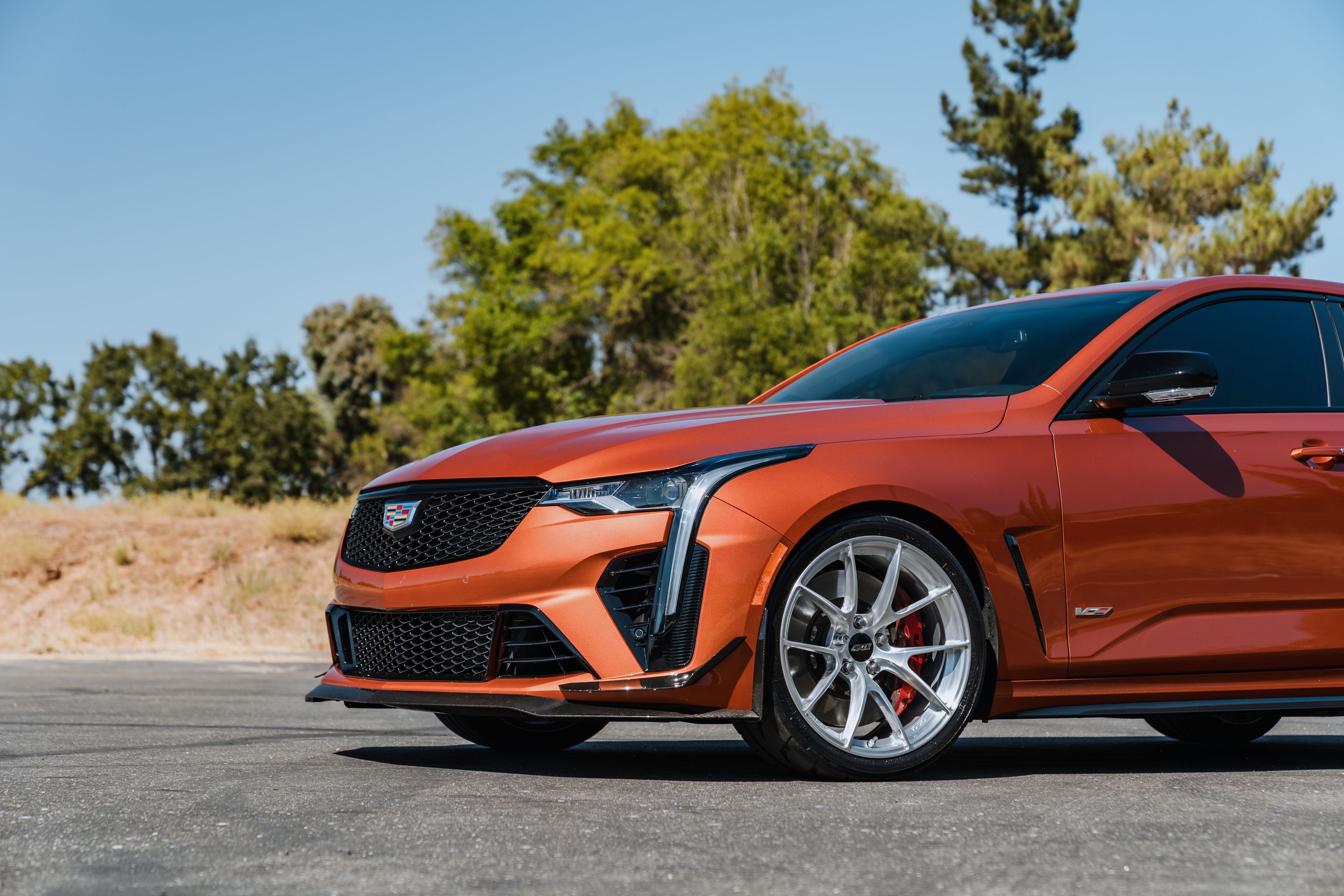 Orange Cadillac CT4-V Blackwing with 19" VS-5RS Apex wheels in Brushed Clear