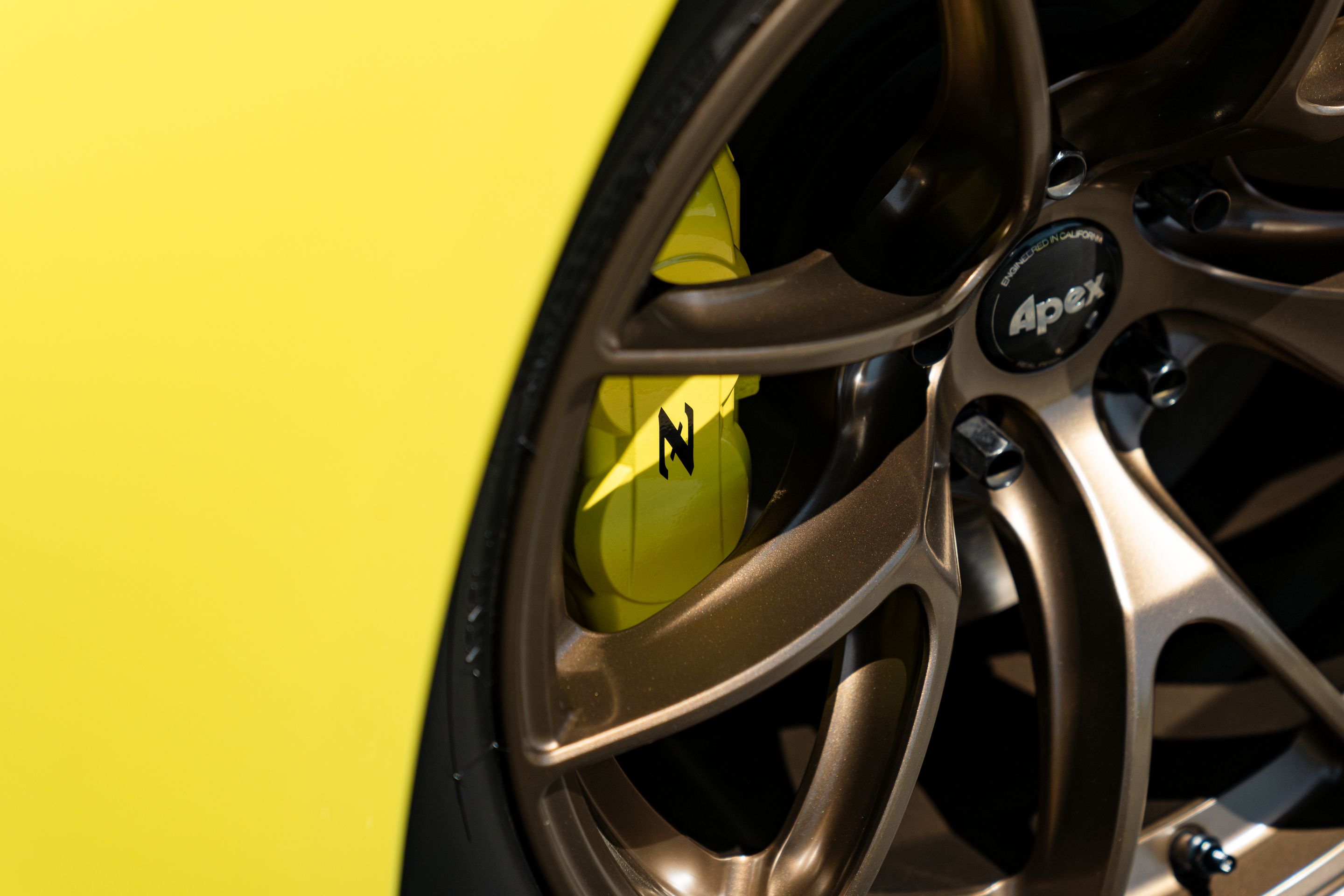 Yellow Nissan Z with 18" VS-5RS Apex wheels in Satin Bronze