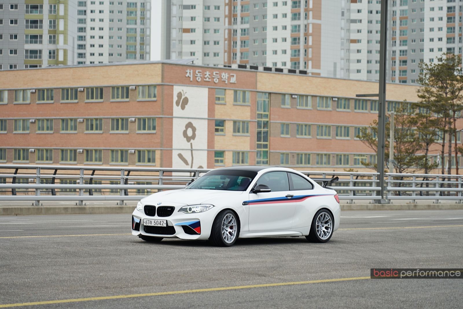 White BMW F87 M2 with 18" EC-7 Apex wheels in Race Silver