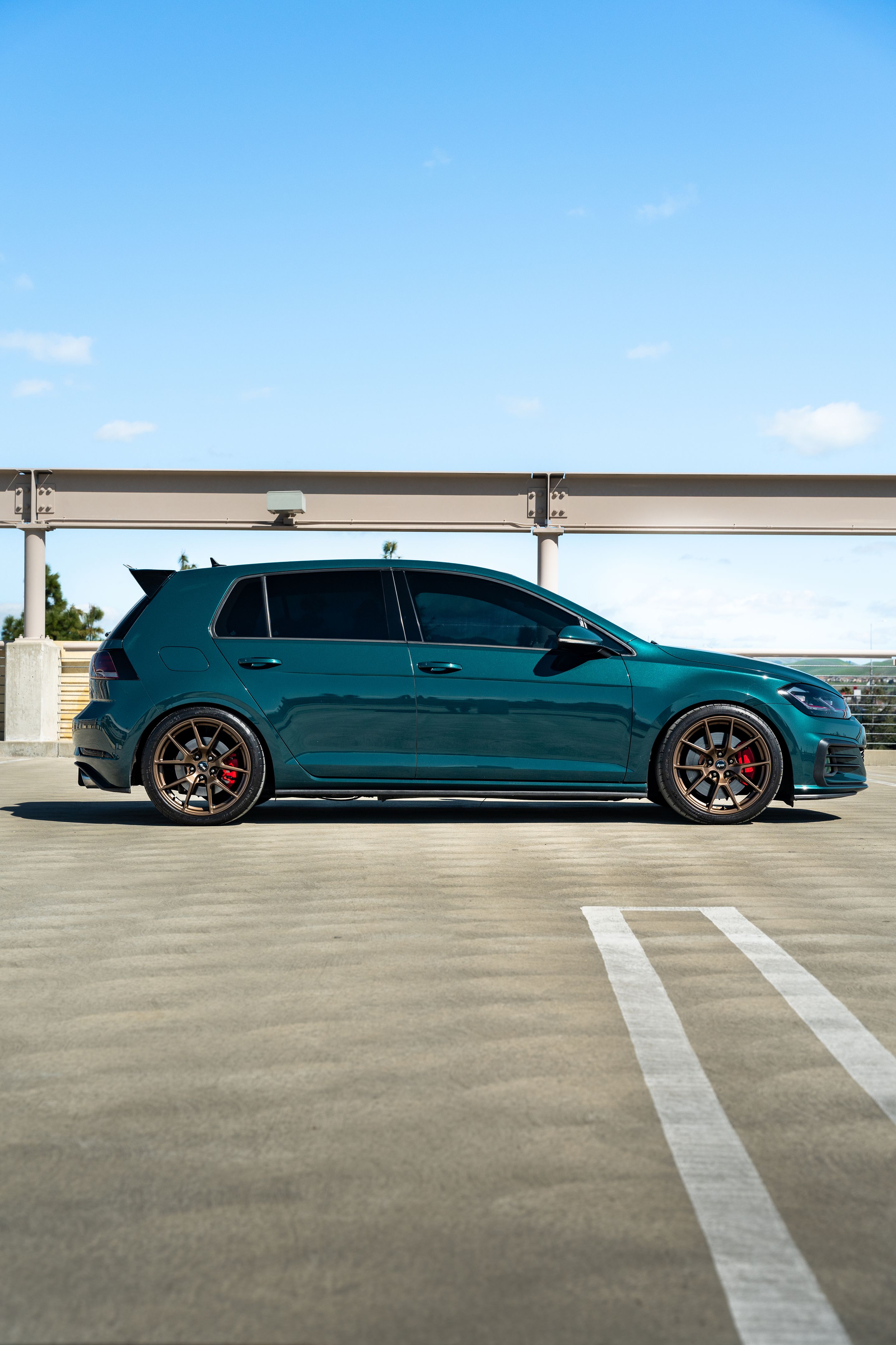 Green VW MK7 GTI with 18" VS-5 Apex wheels in Satin Bronze