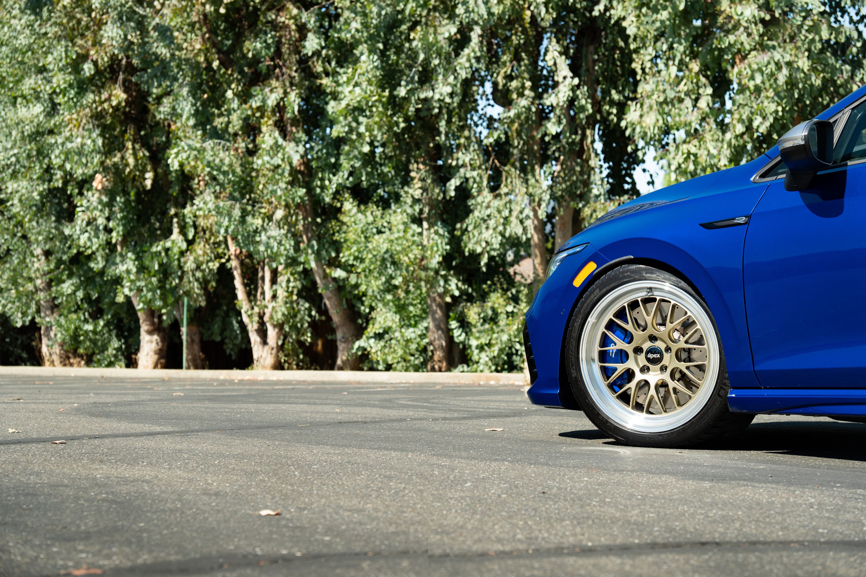 Blue VW MK8 Golf R with 18" ML-10RT Apex wheels in Machined Lip Gloss Motorsport Gold