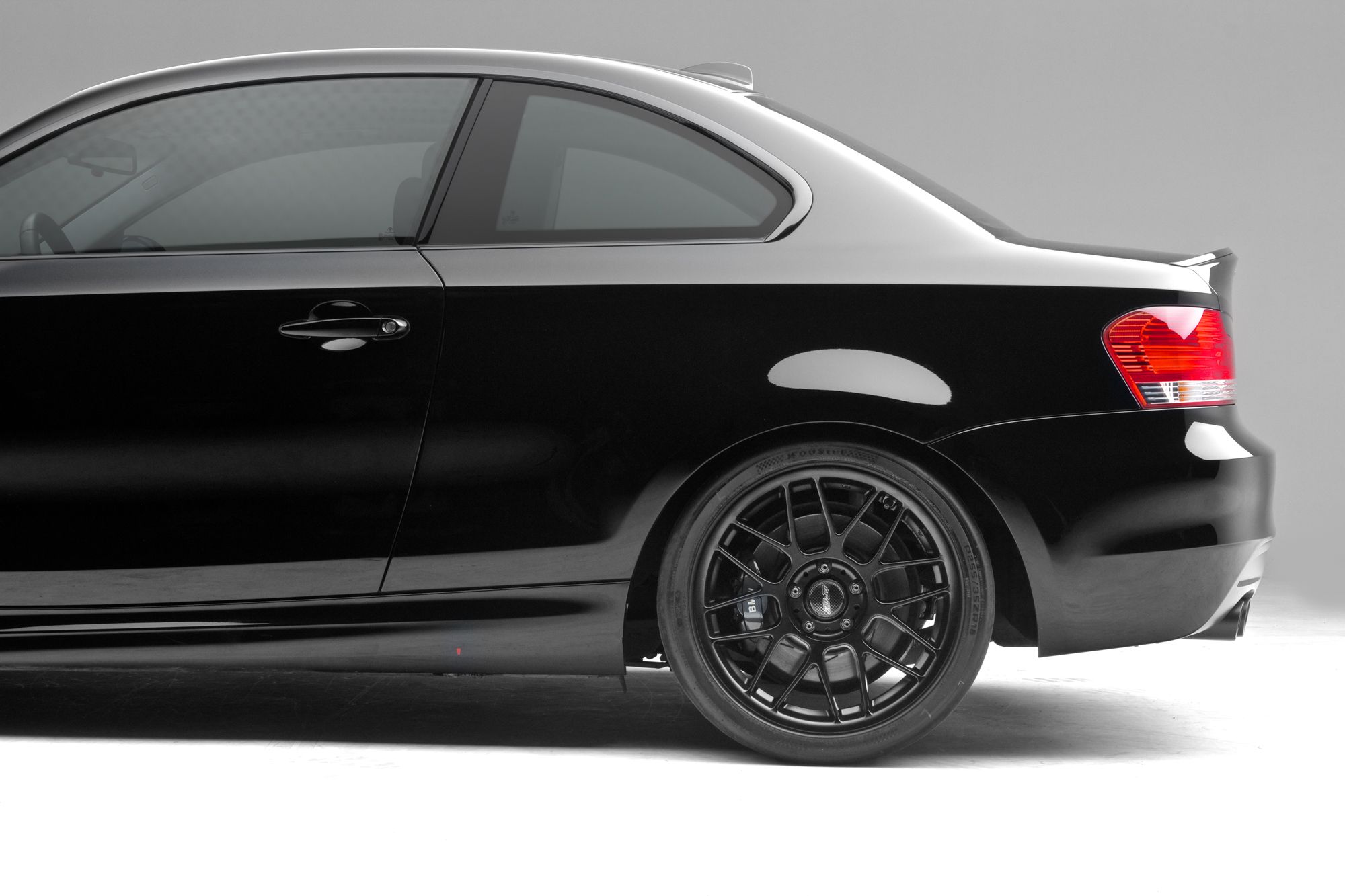 Black BMW E82 Coupe 1 Series with 18" ARC-8 Apex wheels in Satin Black