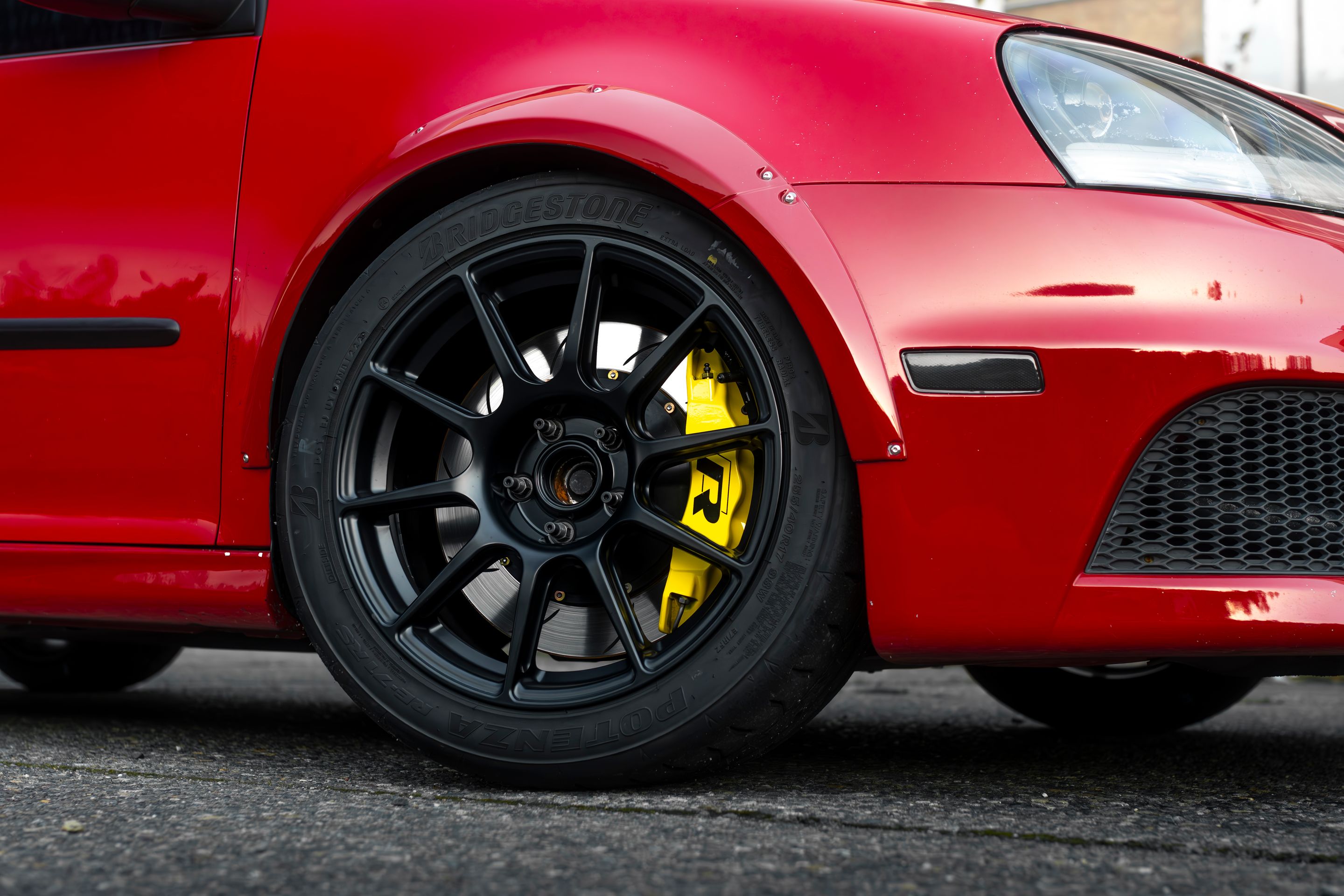 Red VW MK5 Golf with 17" SM-10 Apex wheels in Satin Black