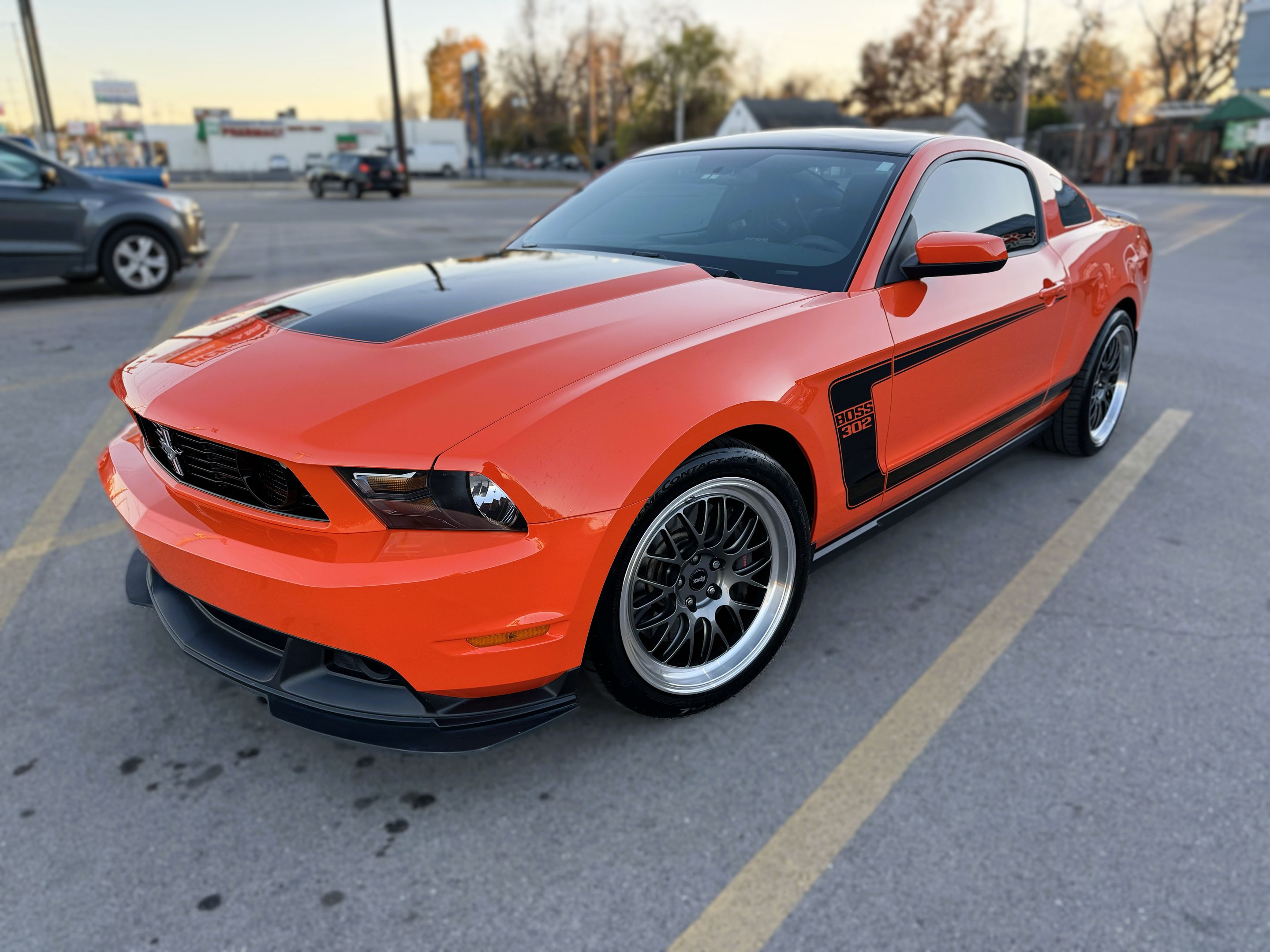 Orange Ford S197 Mustang Boss 302 with 19" ML-10RT Apex wheels in Machined Lip Anthracite