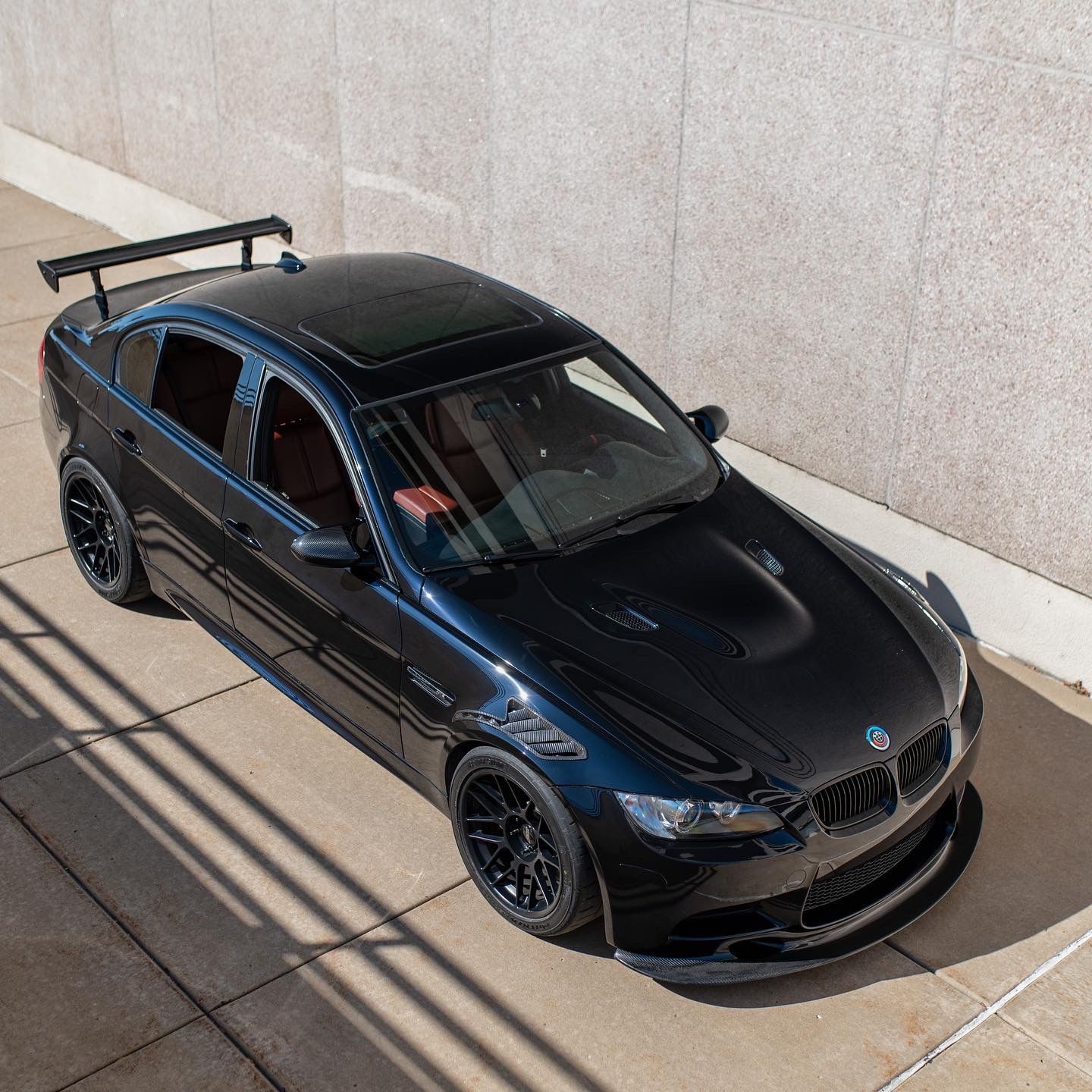 Black BMW E90 Sedan M3 with 18" ARC-8 Apex wheels in Satin Black