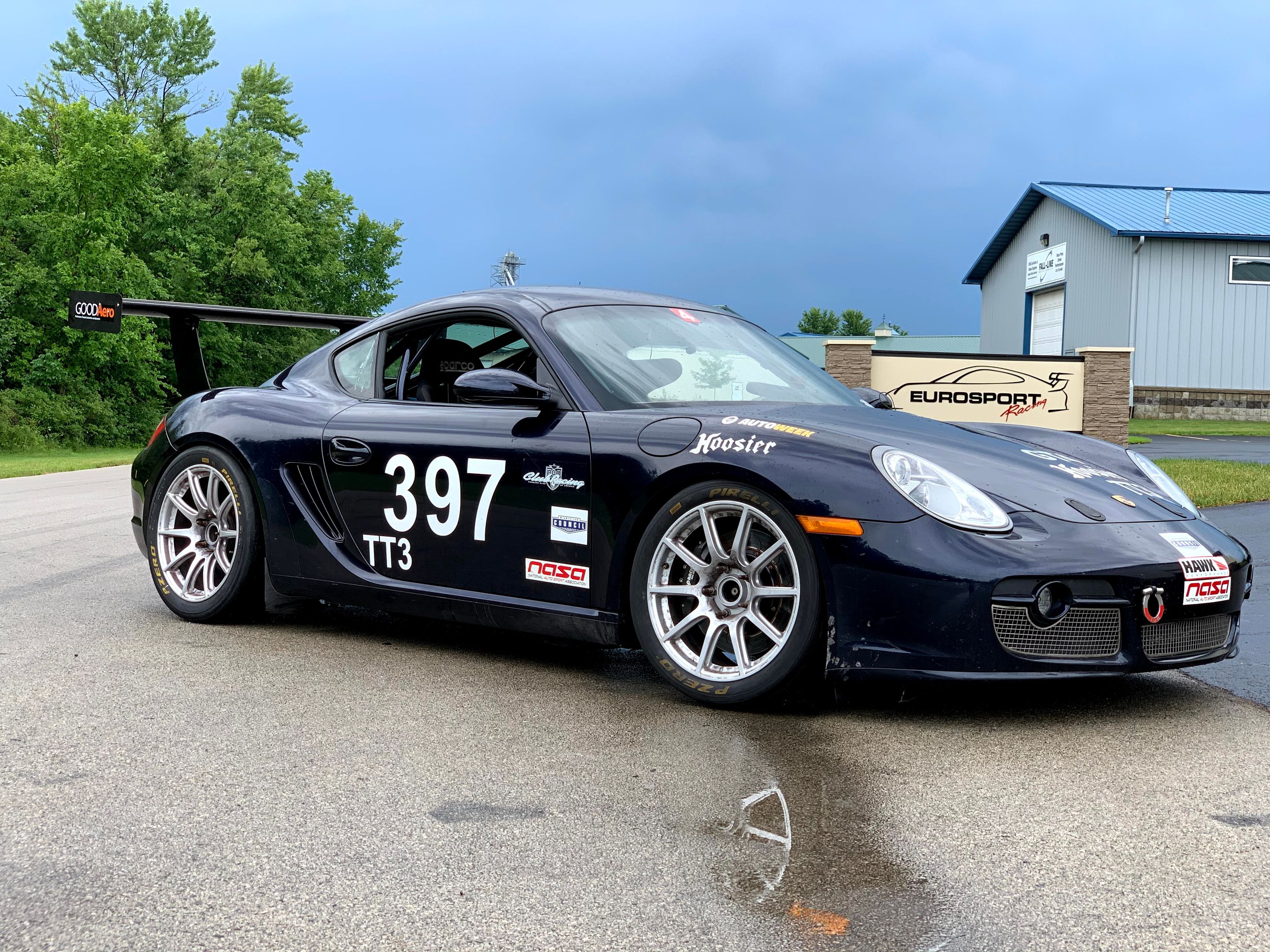 Black Porsche 987 Cayman S with 18" SM-10 Apex wheels in Race Silver