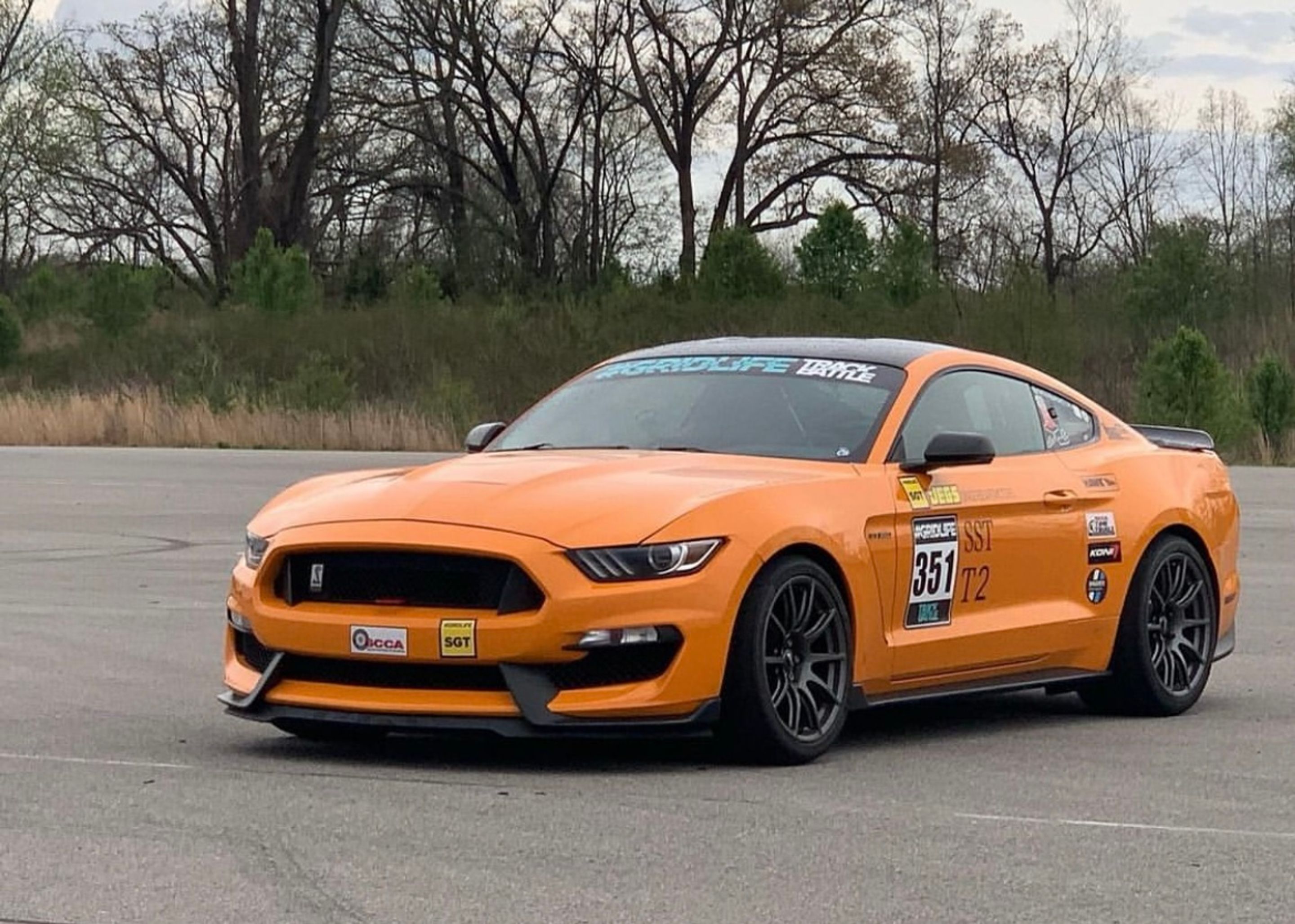 Orange Ford S550 Mustang GT350 with 19" SM-10 Apex wheels in Anthracite