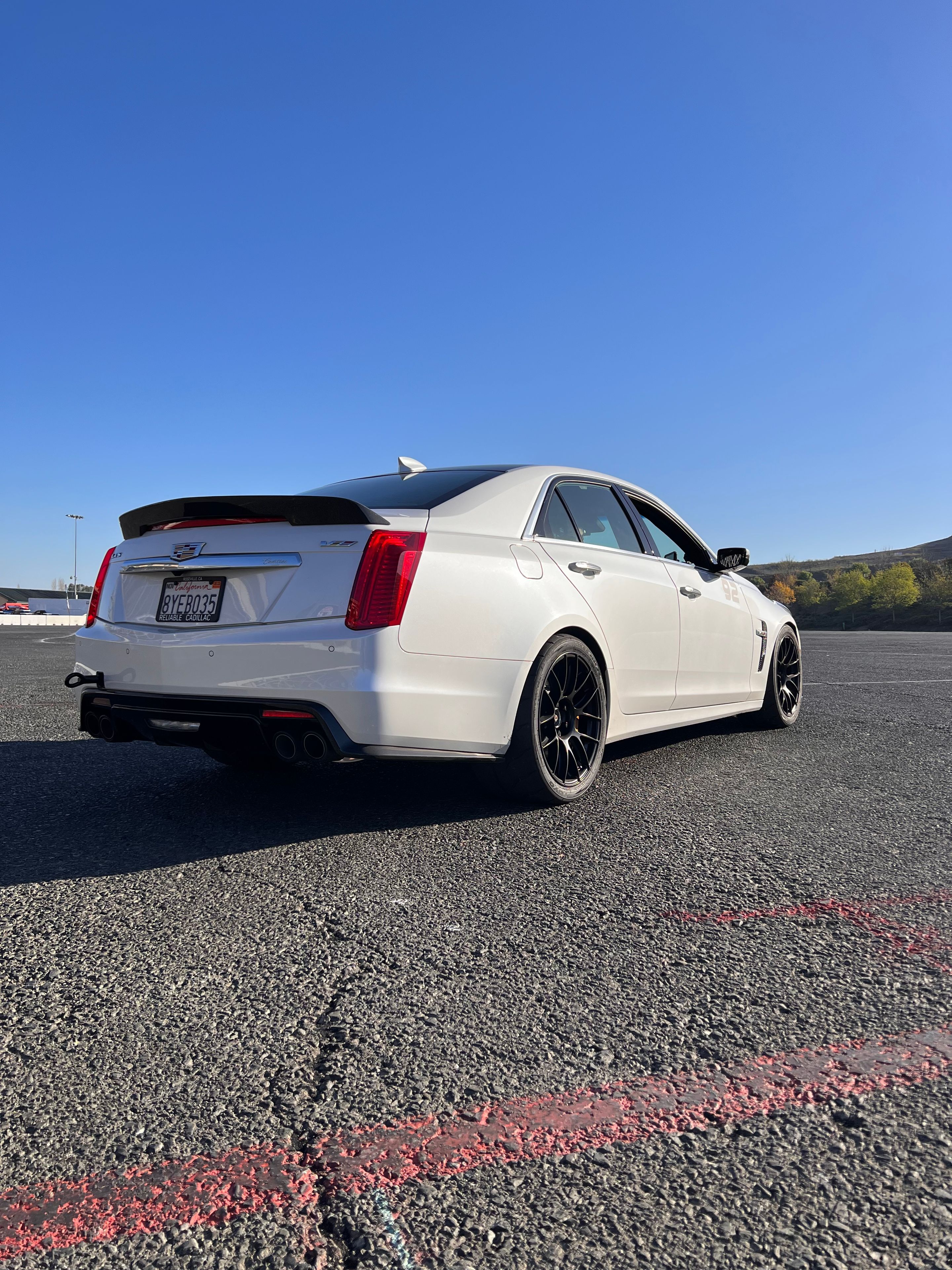 White Cadillac Gen 3 CTS-V with 19" EC-7RS Apex wheels in Satin Black