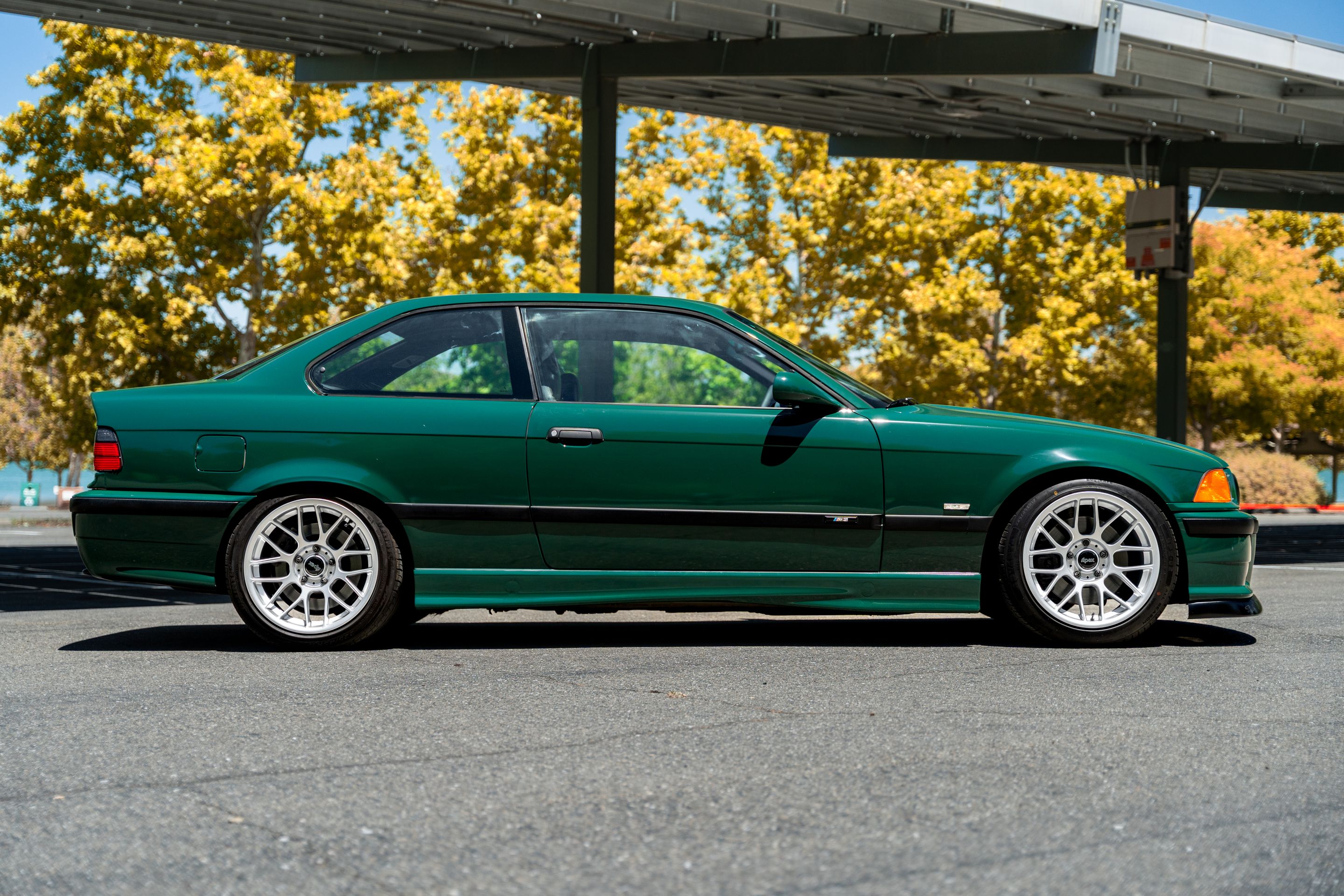 Green BMW E36 M3 with 17" ARC-8 Apex wheels in Race Silver