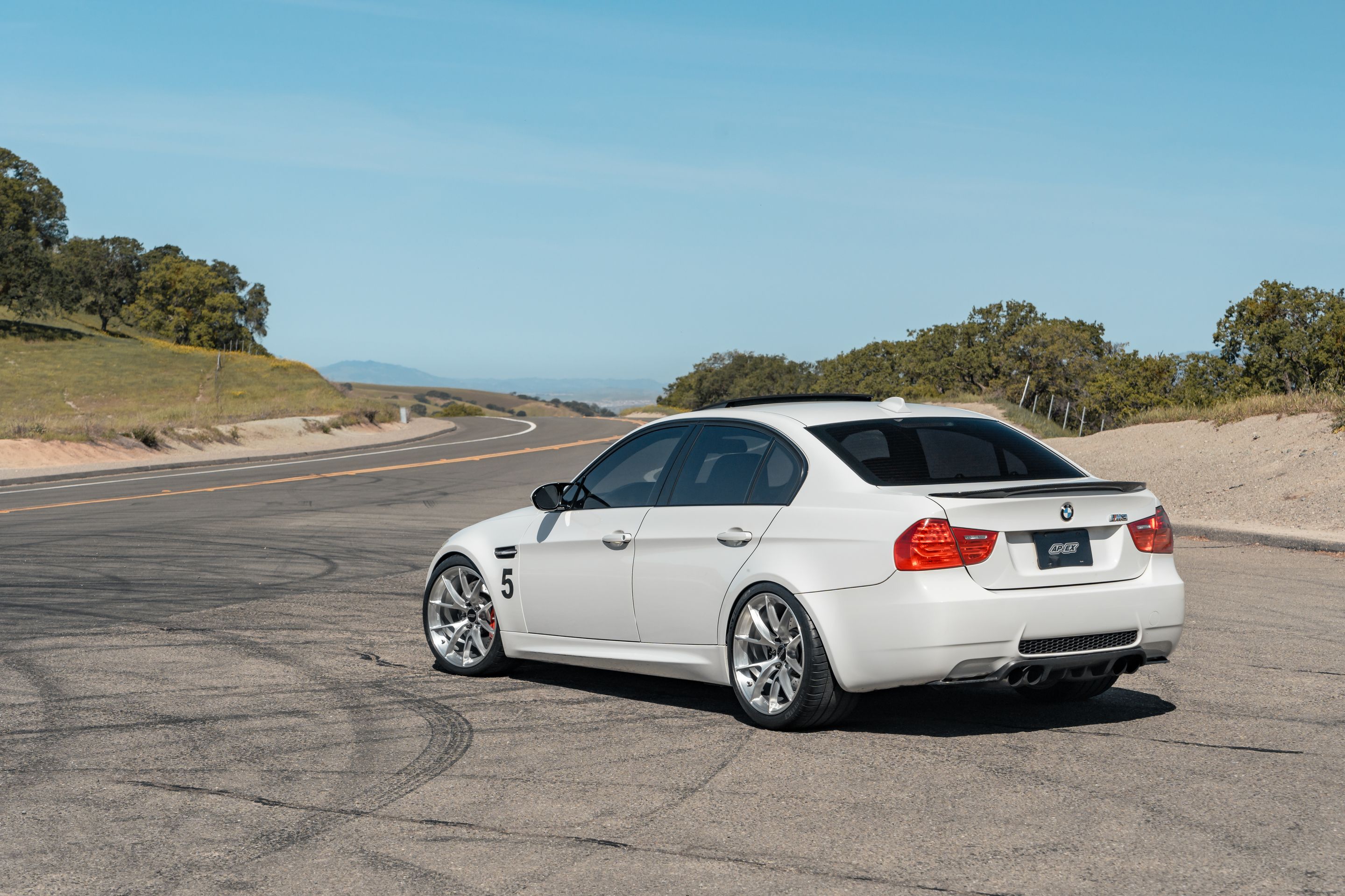 White BMW E90 Sedan M3 with 19" VS-5RS Apex wheels in Brushed Clear