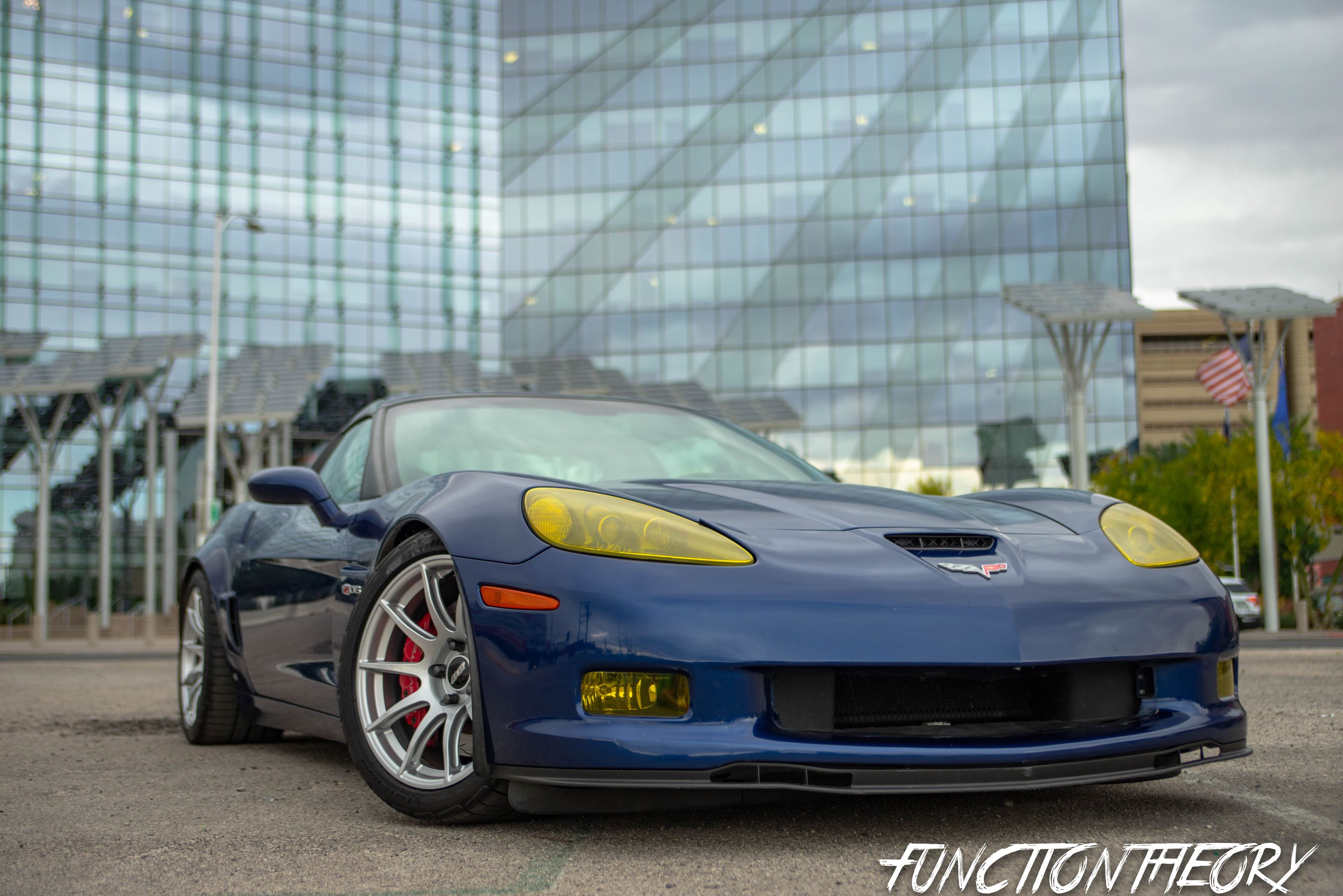 Blue Chevrolet C6 Corvette Z06 with 18" SM-10 Apex wheels in Race Silver