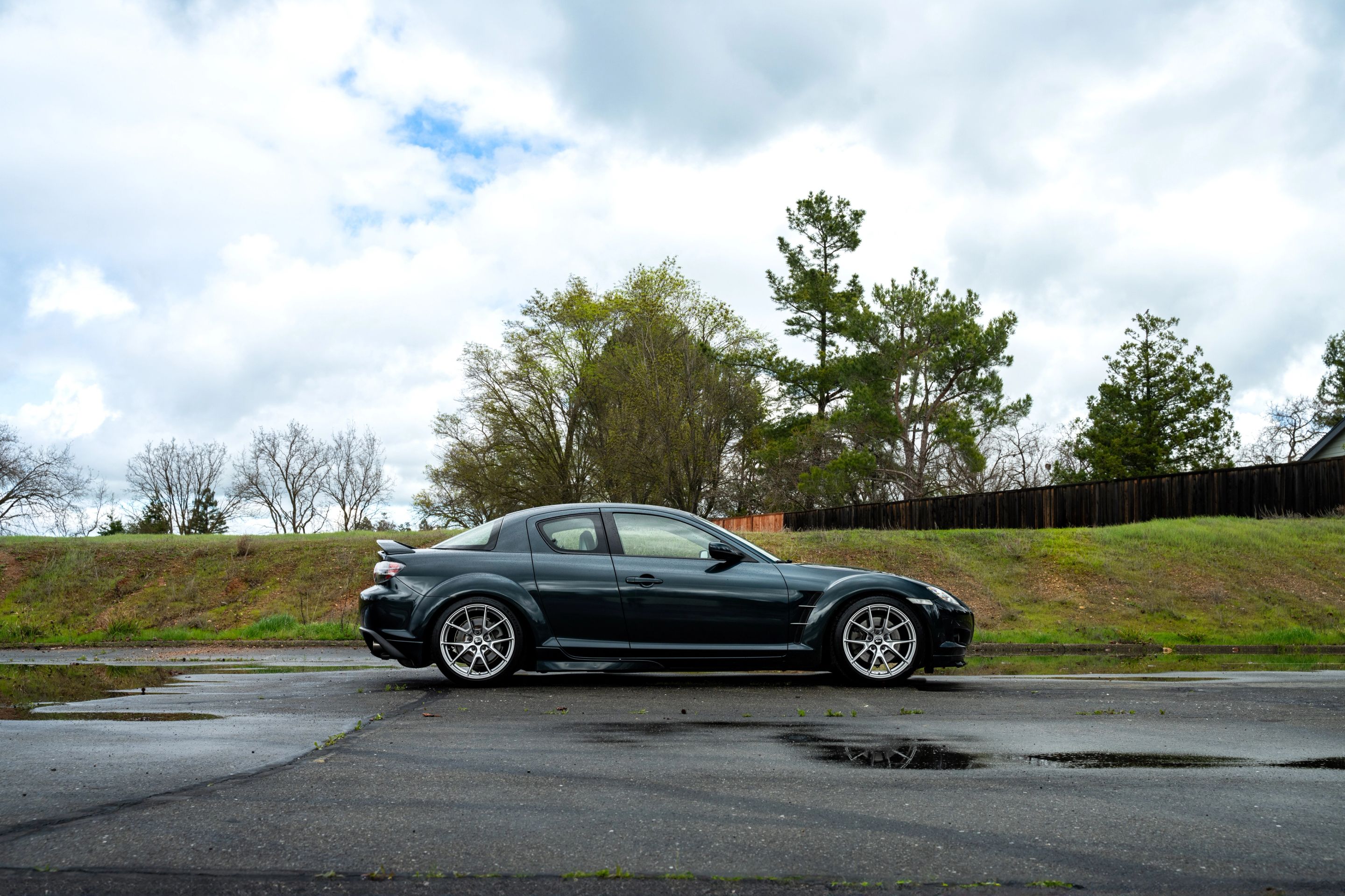 Green Mazda RX-8 with 18" VS-5 Apex wheels in Hyper Black