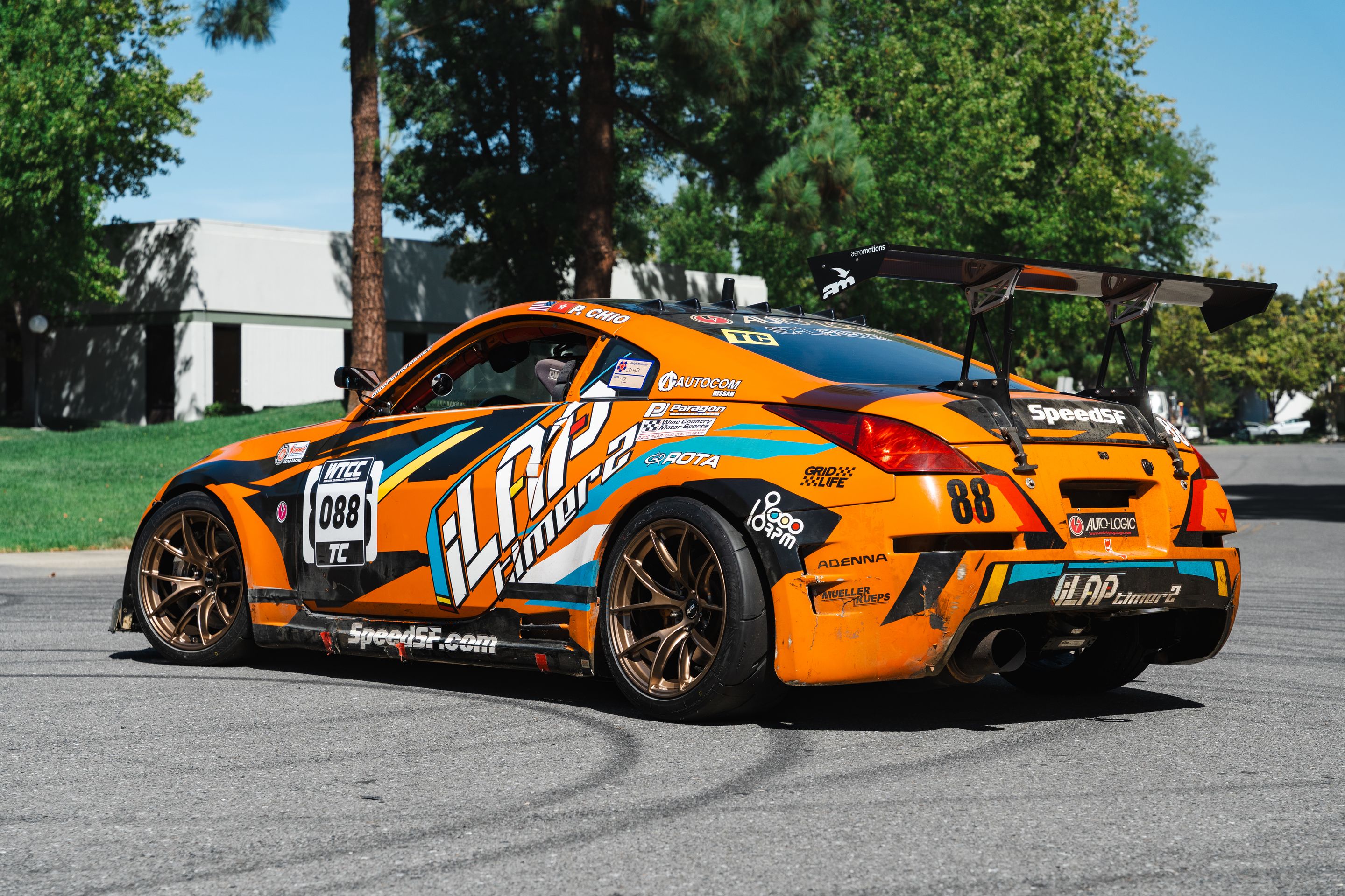 Orange Nissan 350Z with 18" VS-5RS Apex wheels in Satin Bronze