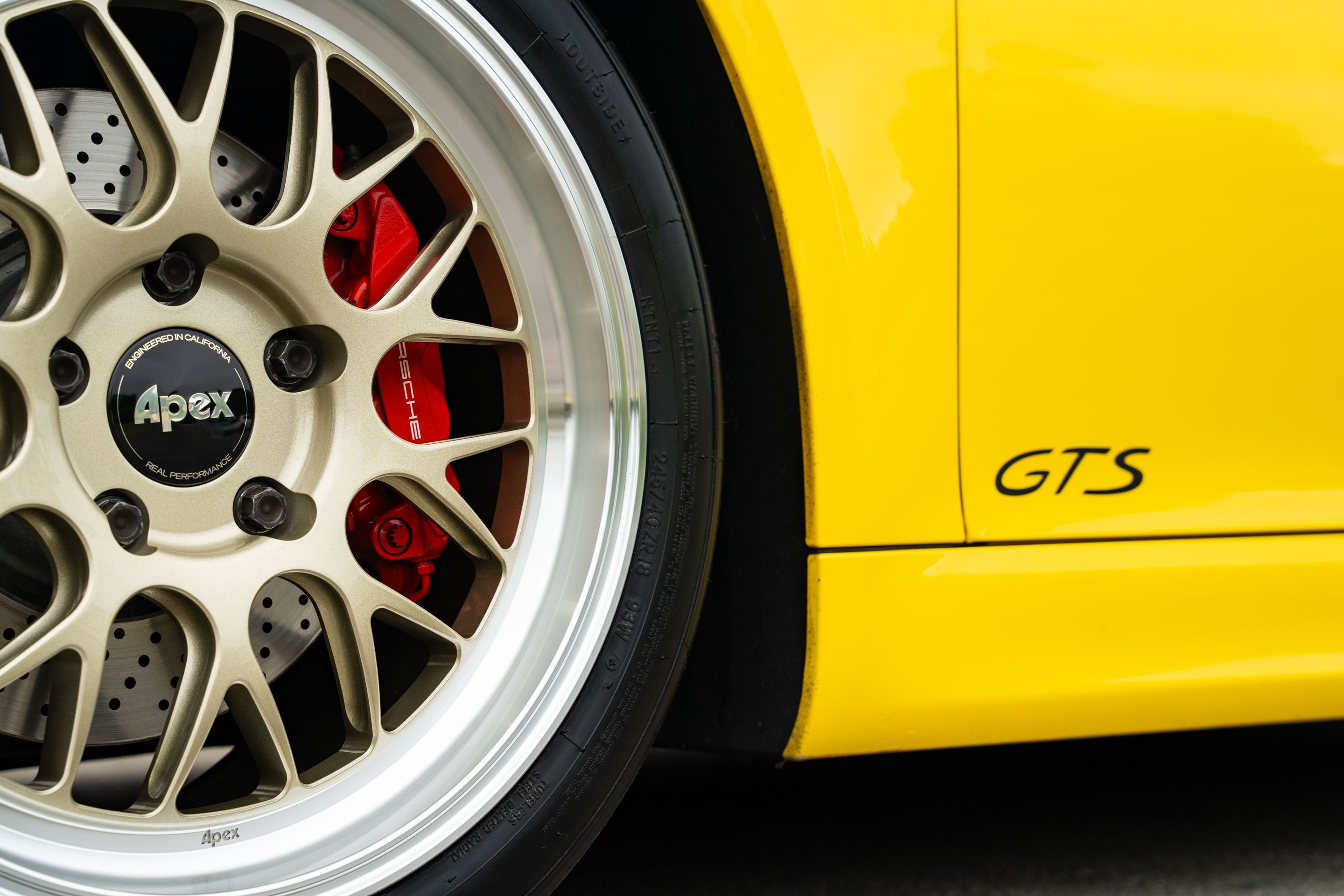 Yellow Porsche 981 Cayman GTS with 18" ML-10RT Apex wheels in Machined Lip Gloss Motorsport Gold