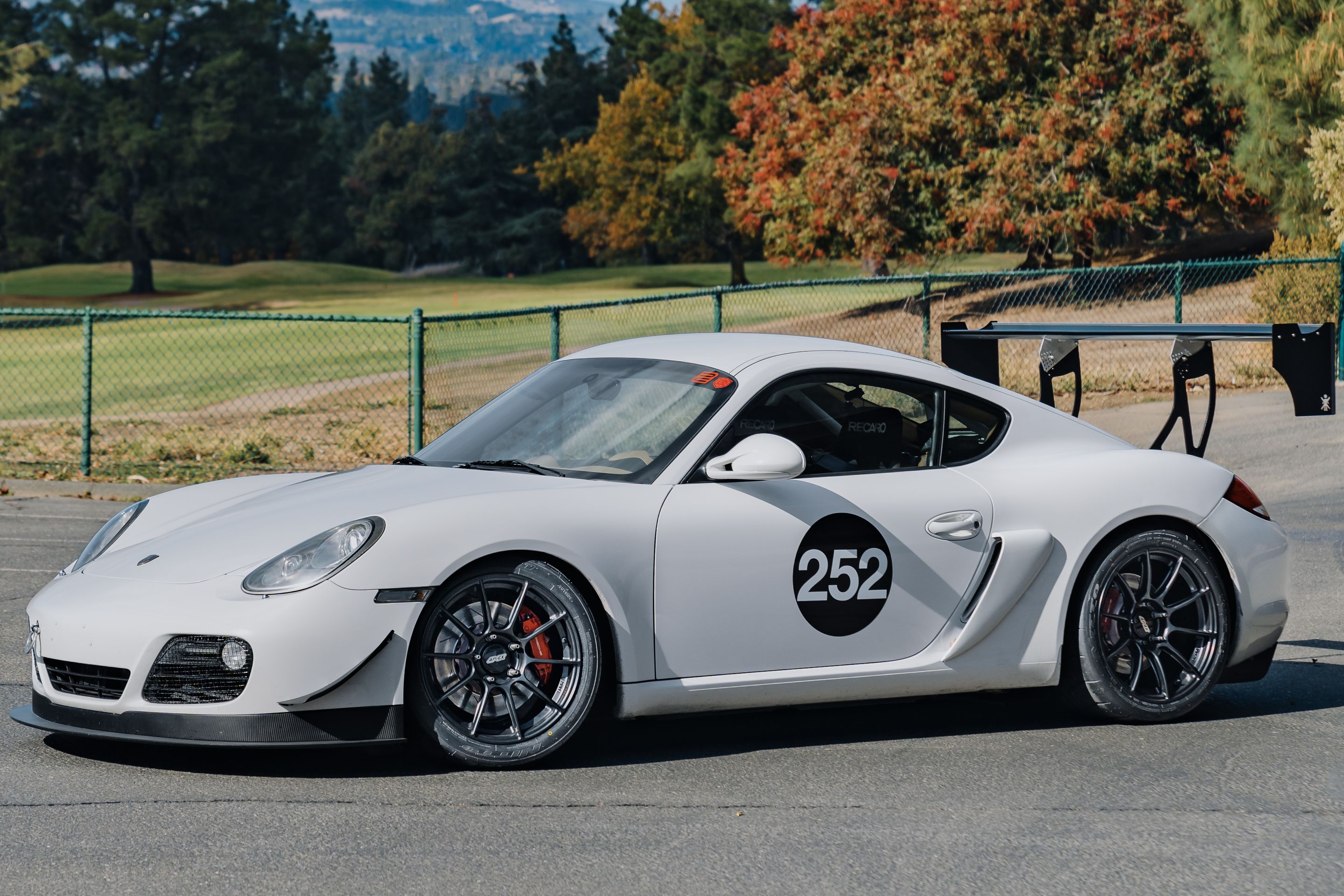 White Porsche 987 Cayman S with 18" SM-10RS Apex wheels in Satin Black