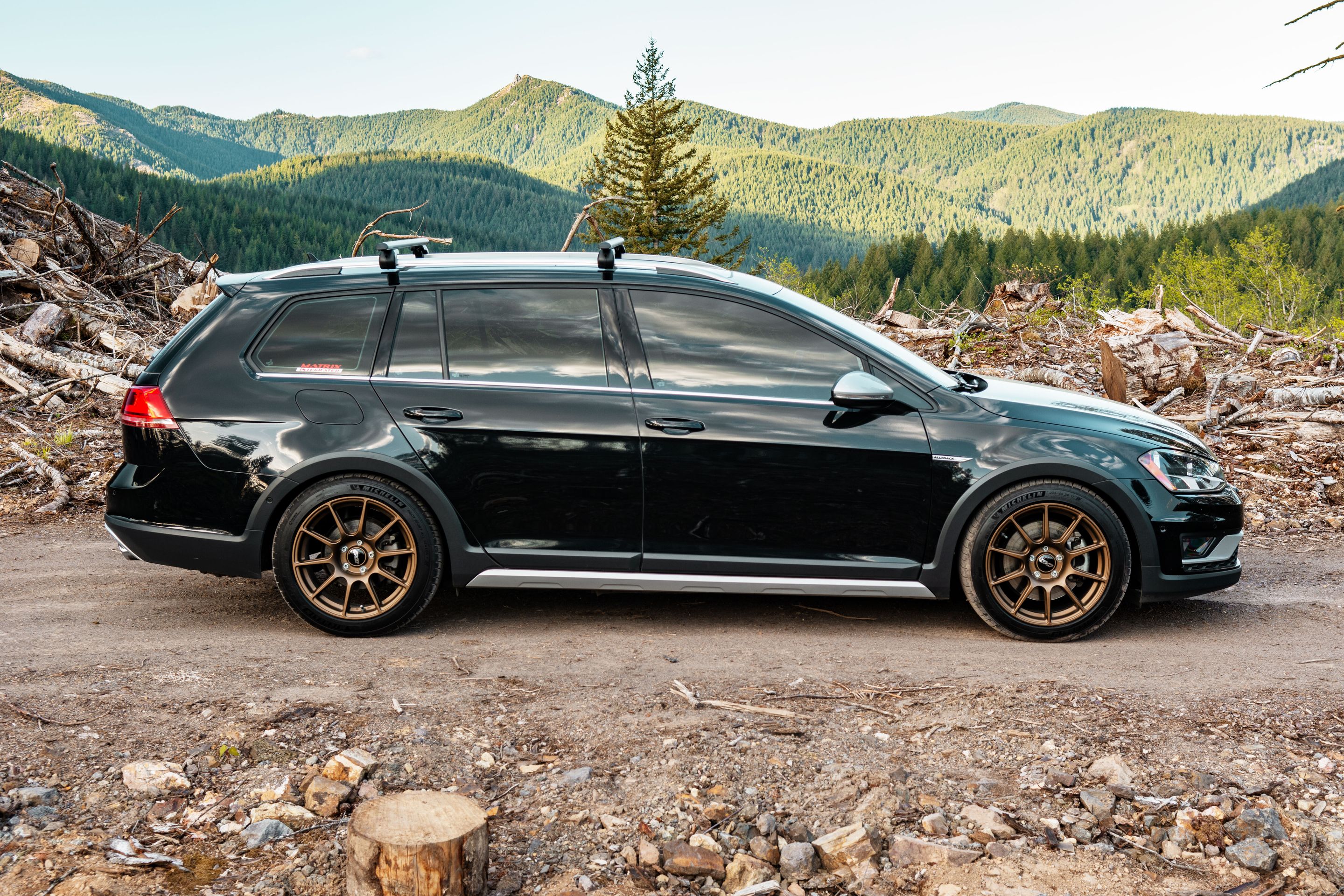 Black VW MK7 Alltrack/SportWagen Golf SportWagen with 17" SM-10 Apex wheels in Satin Bronze
