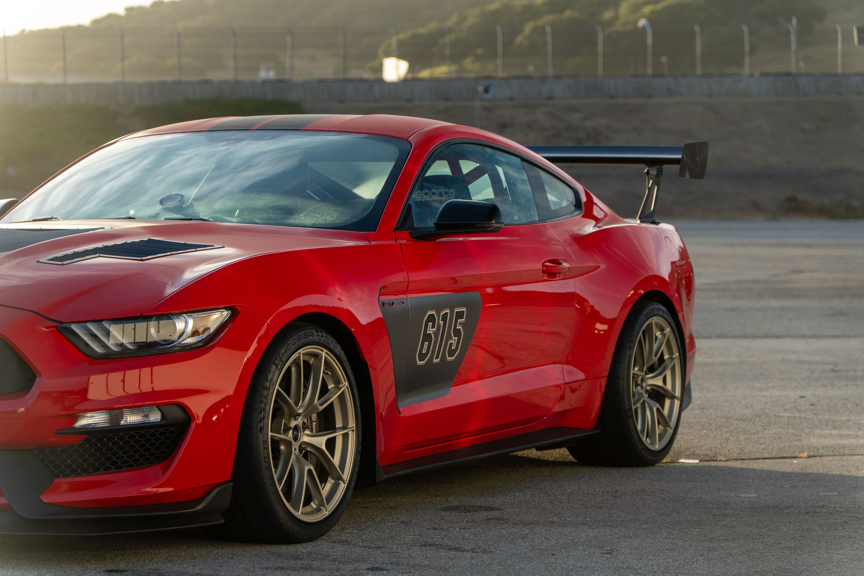 Red Ford S550 Mustang GT350 with 19" VS-5RS Apex wheels in Motorsport Gold