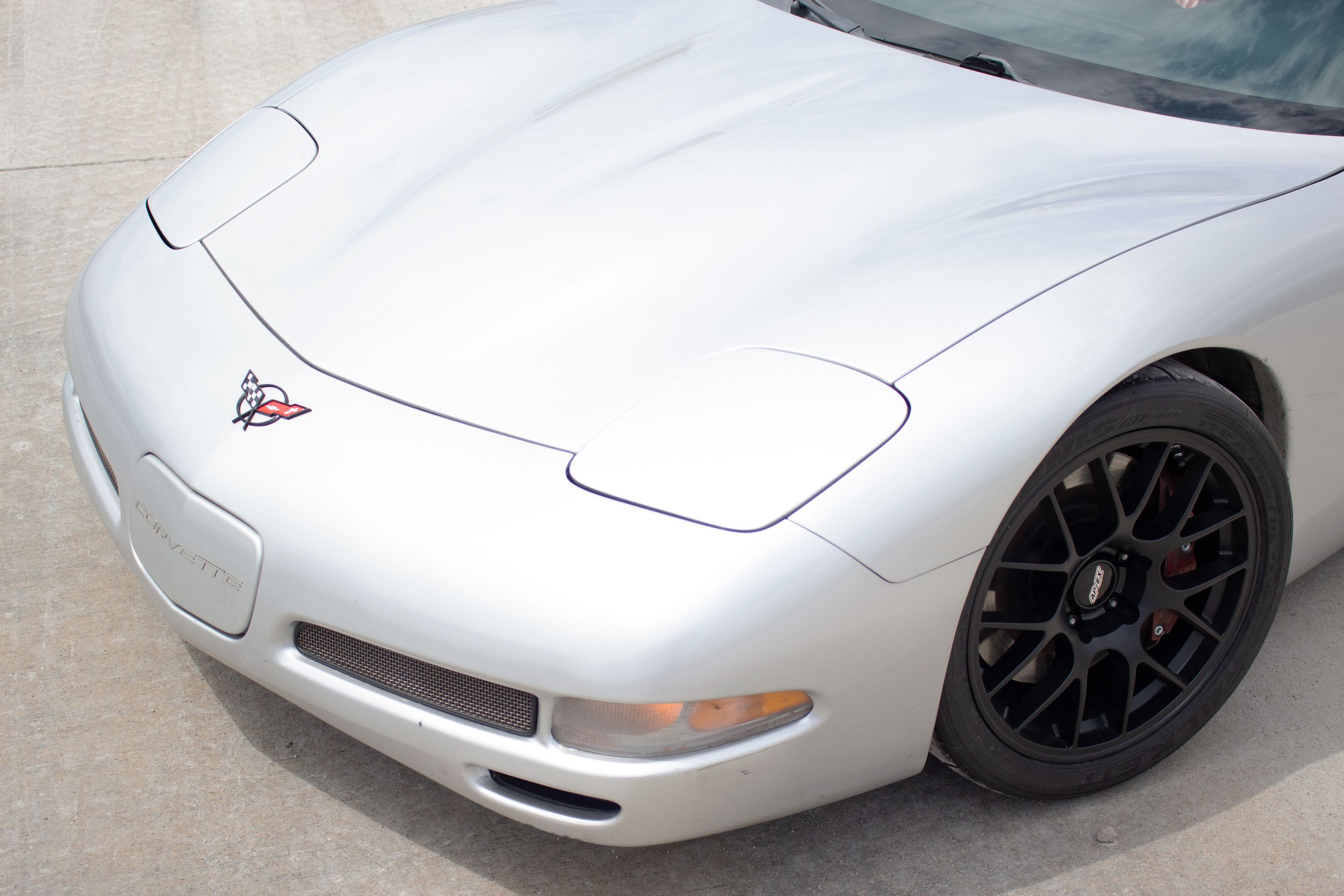 Silver Chevrolet C5 Corvette Z06 with 18" EC-7 Apex wheels in Satin Black