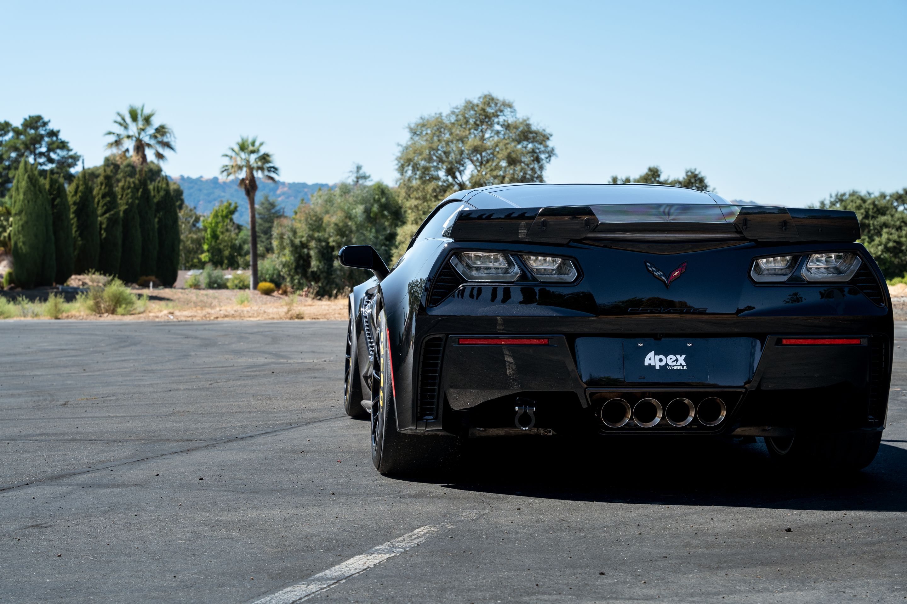 Black Chevrolet C7 Corvette Z06 with 18" SM-10RE Apex wheels in Satin Black