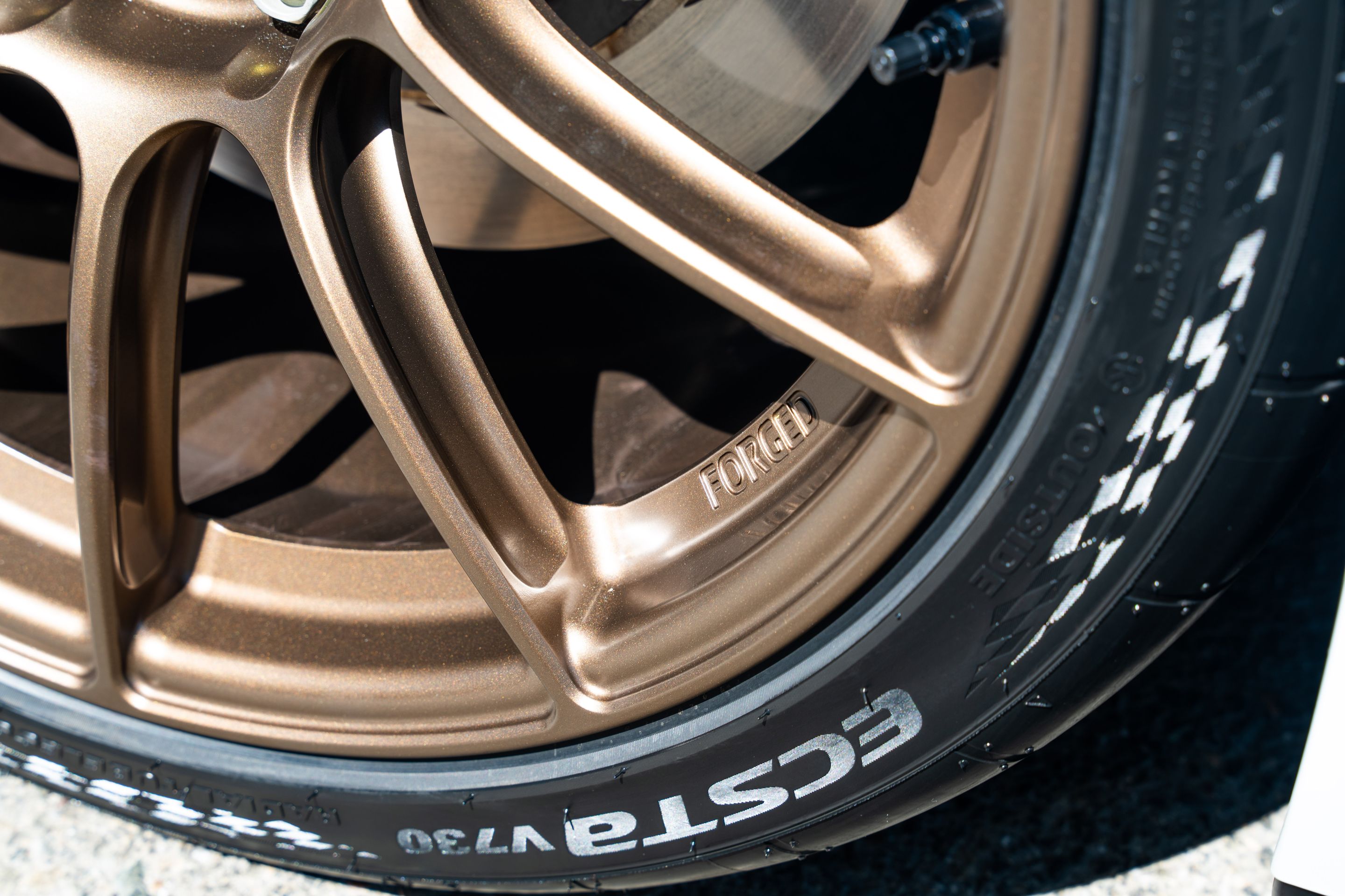 White Tesla Model 3 with 19" SM-10RS Apex wheels in Satin Bronze