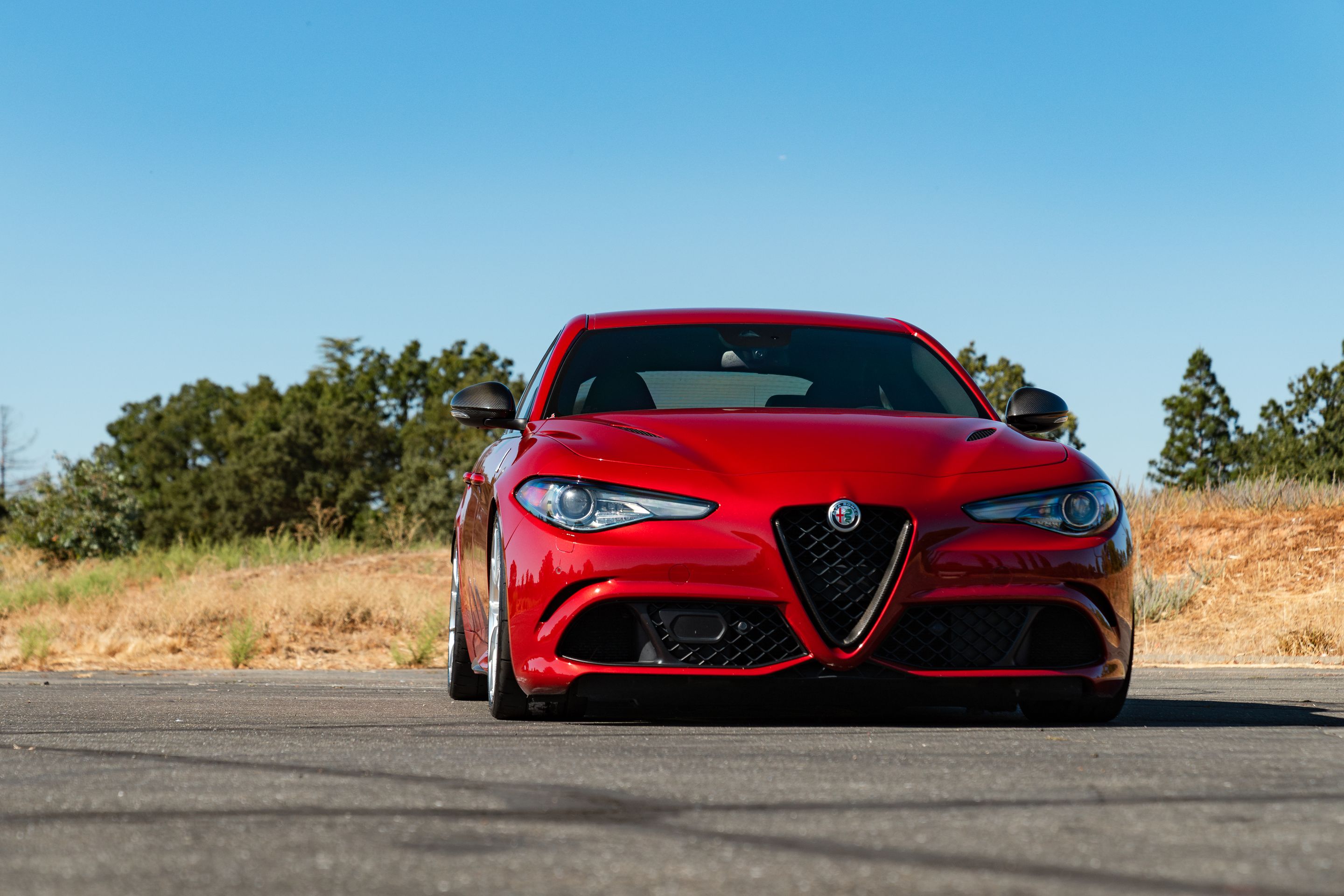 Red Alfa Romeo Giulia Quadrifoglio with 19" VS-5RS Apex wheels in Brushed Clear