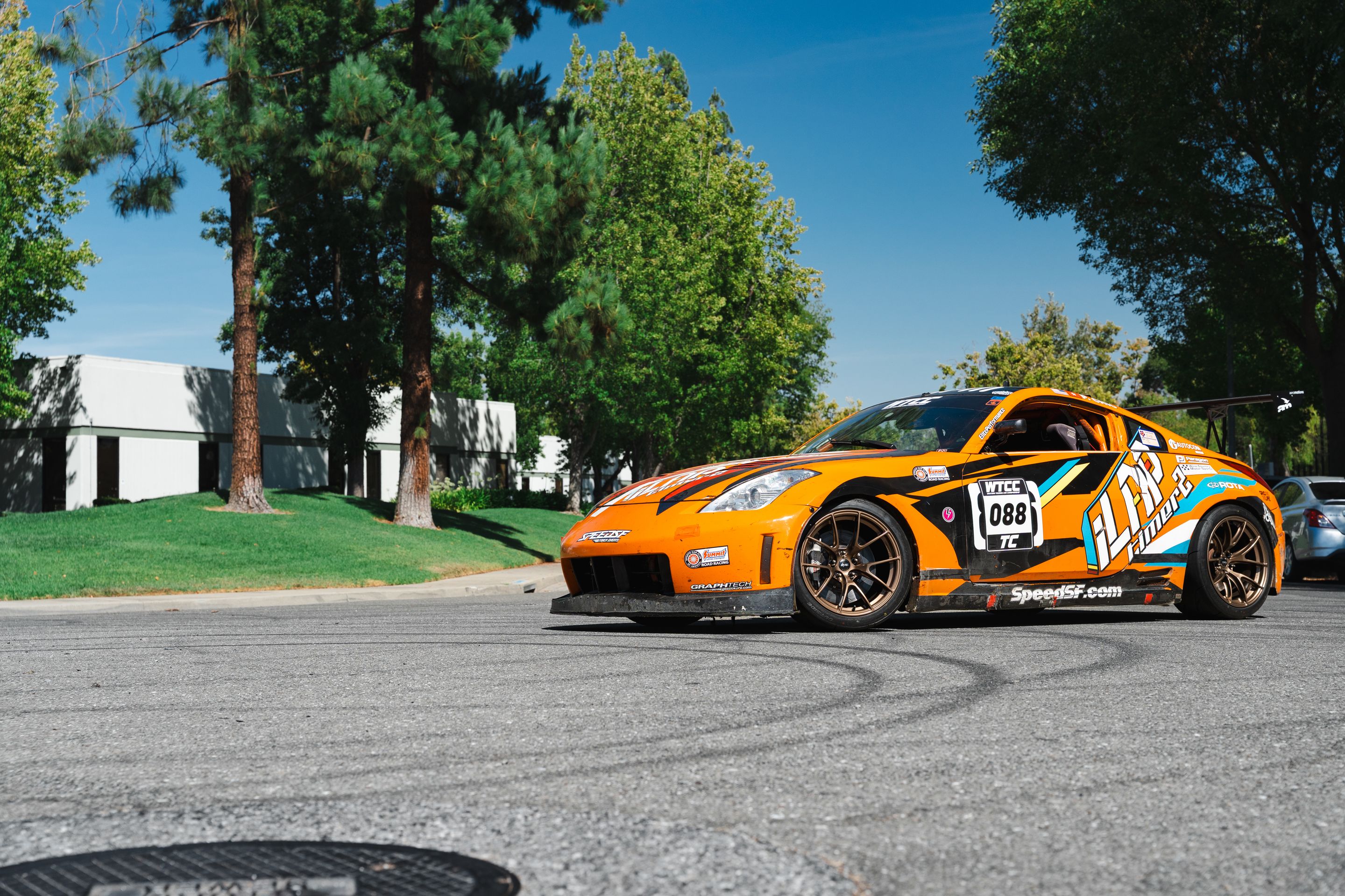 Orange Nissan 350Z with 18" VS-5RS Apex wheels in Satin Bronze