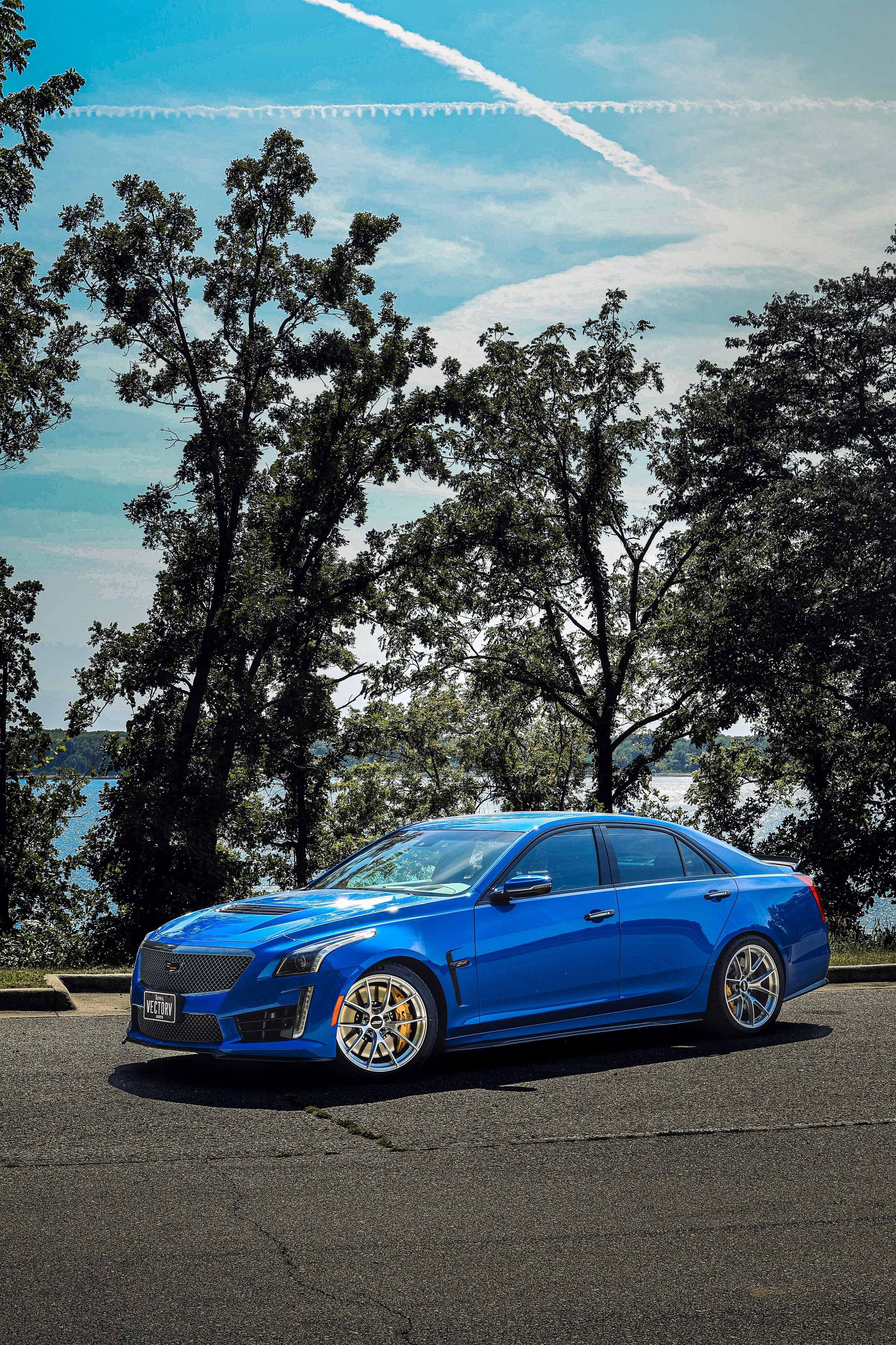 Blue Cadillac Gen 3 CTS-V with 19" VS-5RS Apex wheels in Brushed Clear