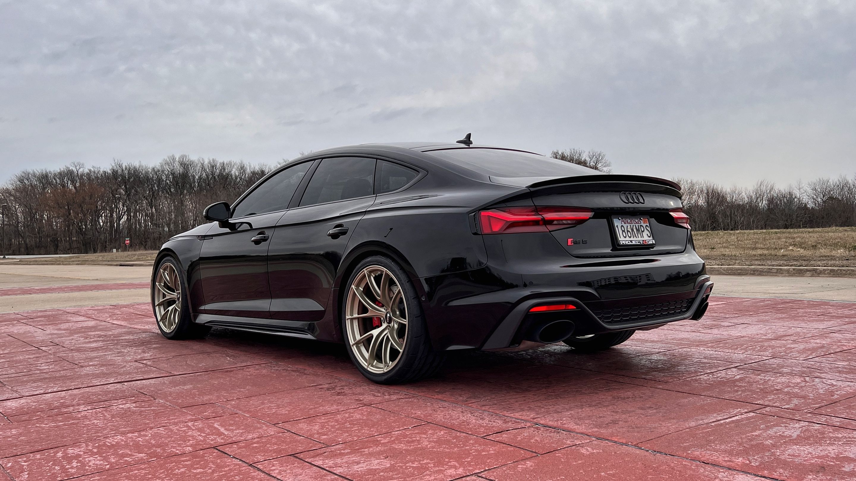 Black Audi B9 RS 5 Sportback with 20" VS-5RS Apex wheels in Motorsport Gold
