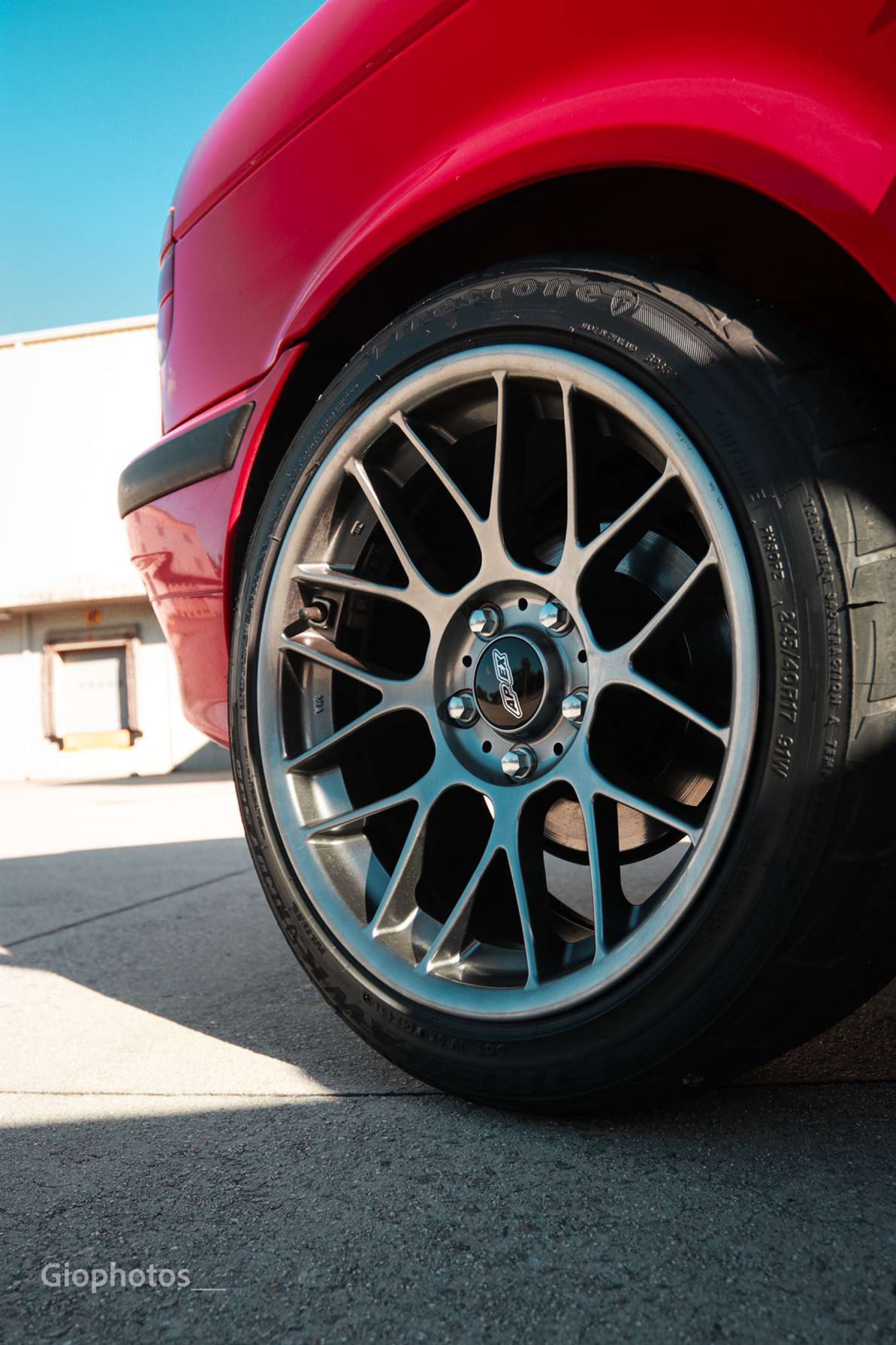 Red BMW E36 3 Series with 17" ARC-8 Apex wheels in Hyper Black