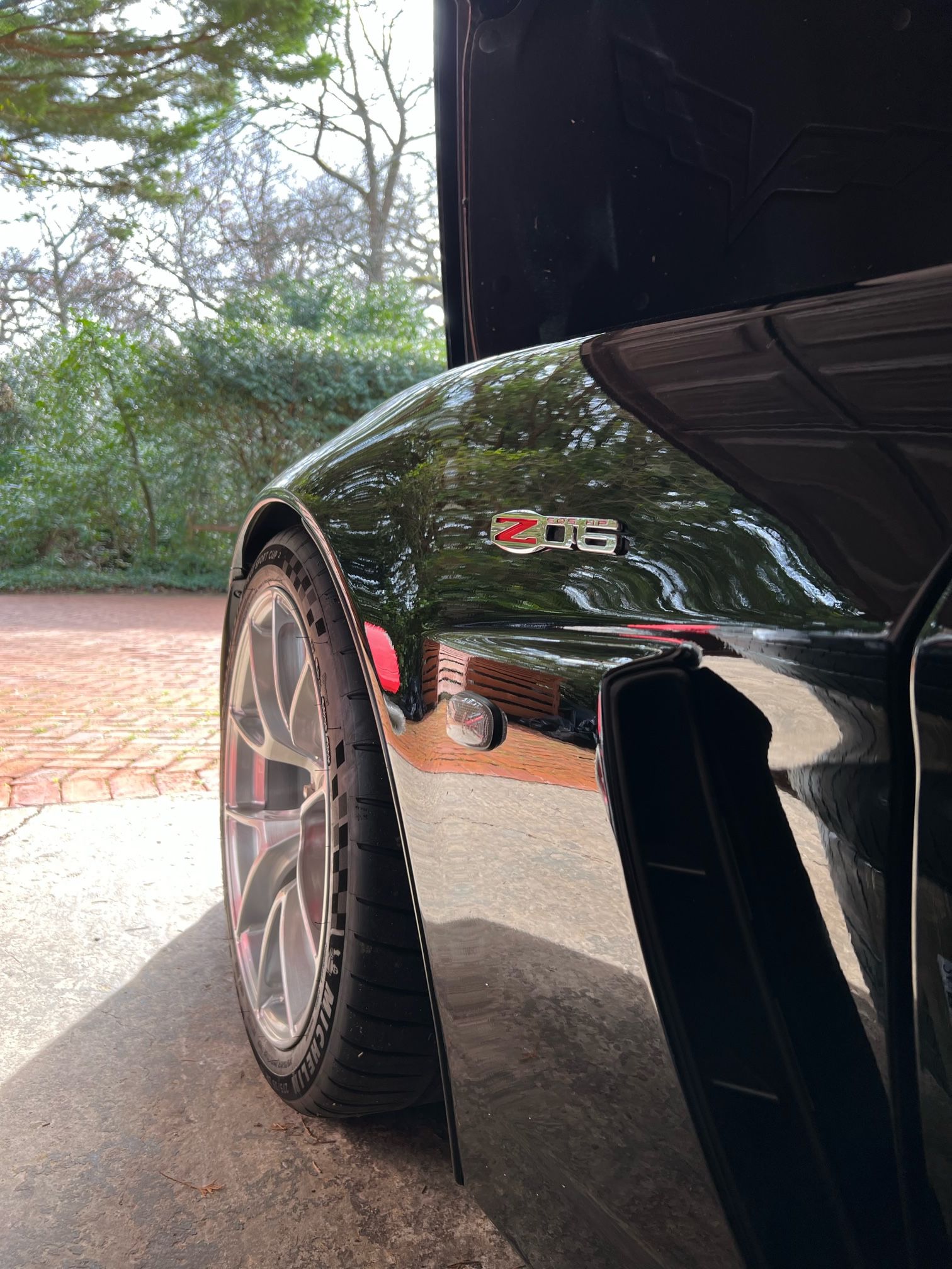 Black Chevrolet C6 Corvette Z06 with 18"/19" VS-5RS Apex wheels in Brushed Clear
