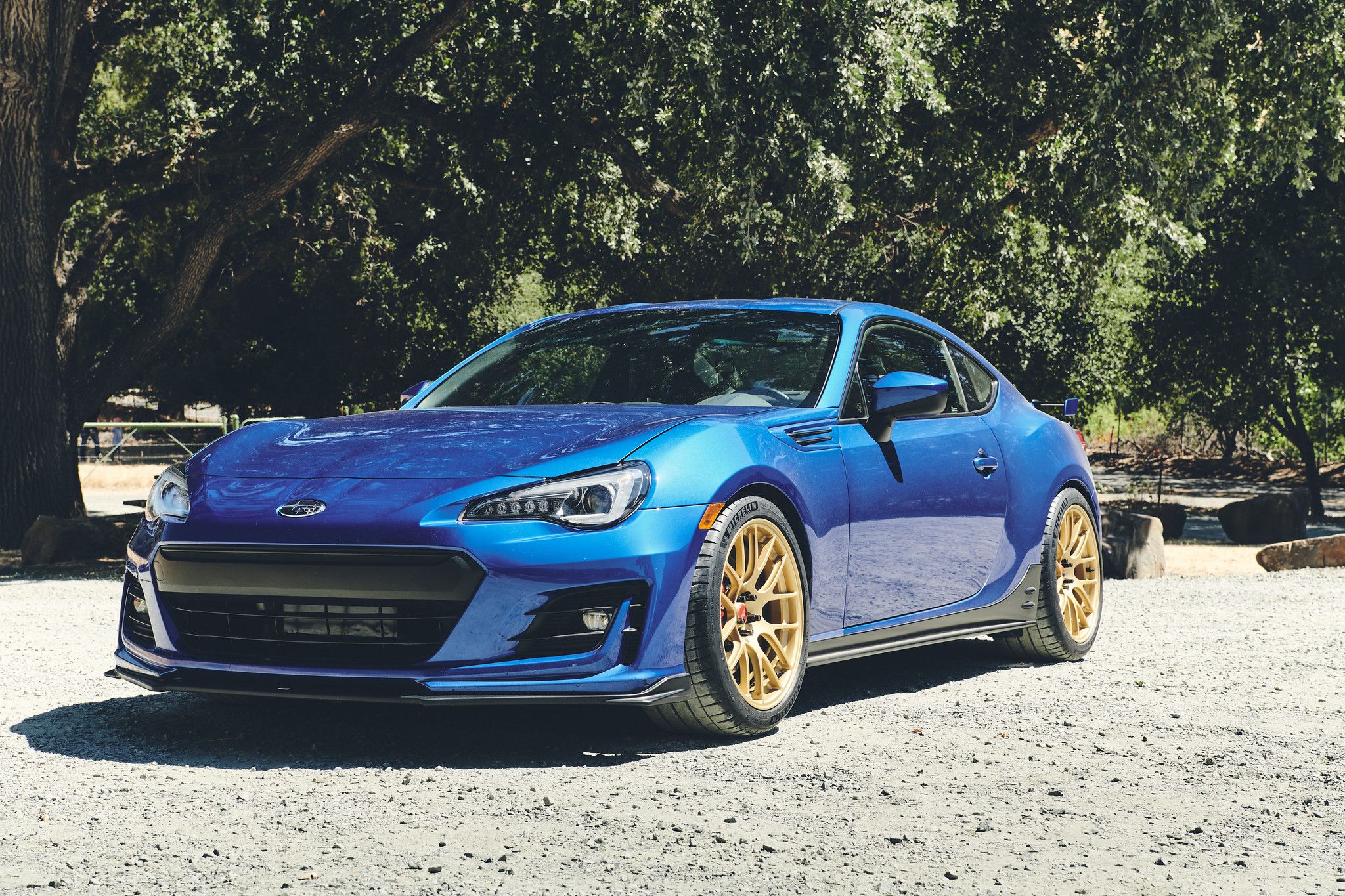 Blue Subaru ZC6 / Gen 1 BRZ with 17" EC-7R Apex wheels in Satin Gold