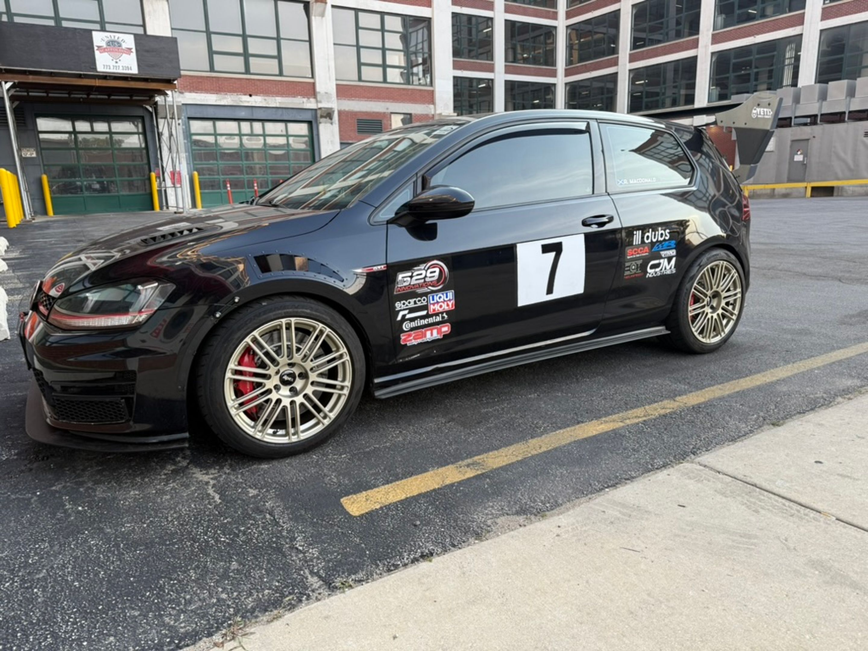 Black VW MK7 GTI with 18" TC-10RT Apex wheels in Motorsport Gold