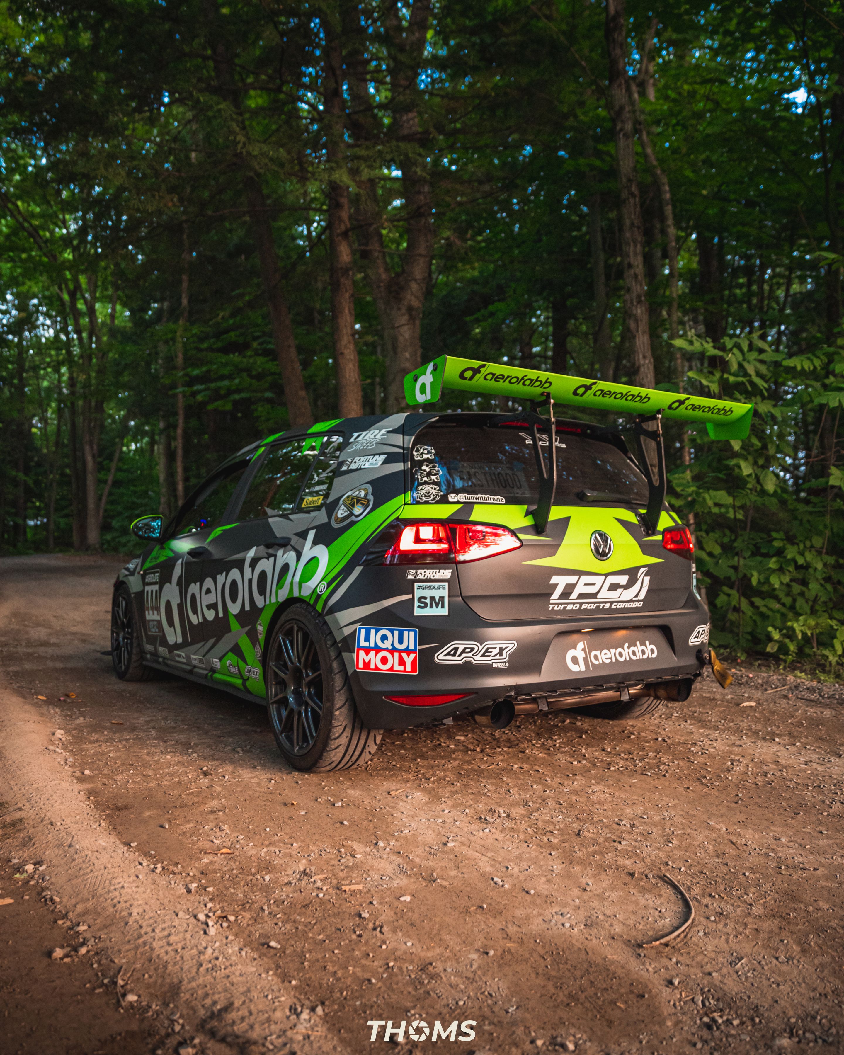 Race Livery VW MK7 GTI with 18" SM-10 Apex wheels in Satin Black